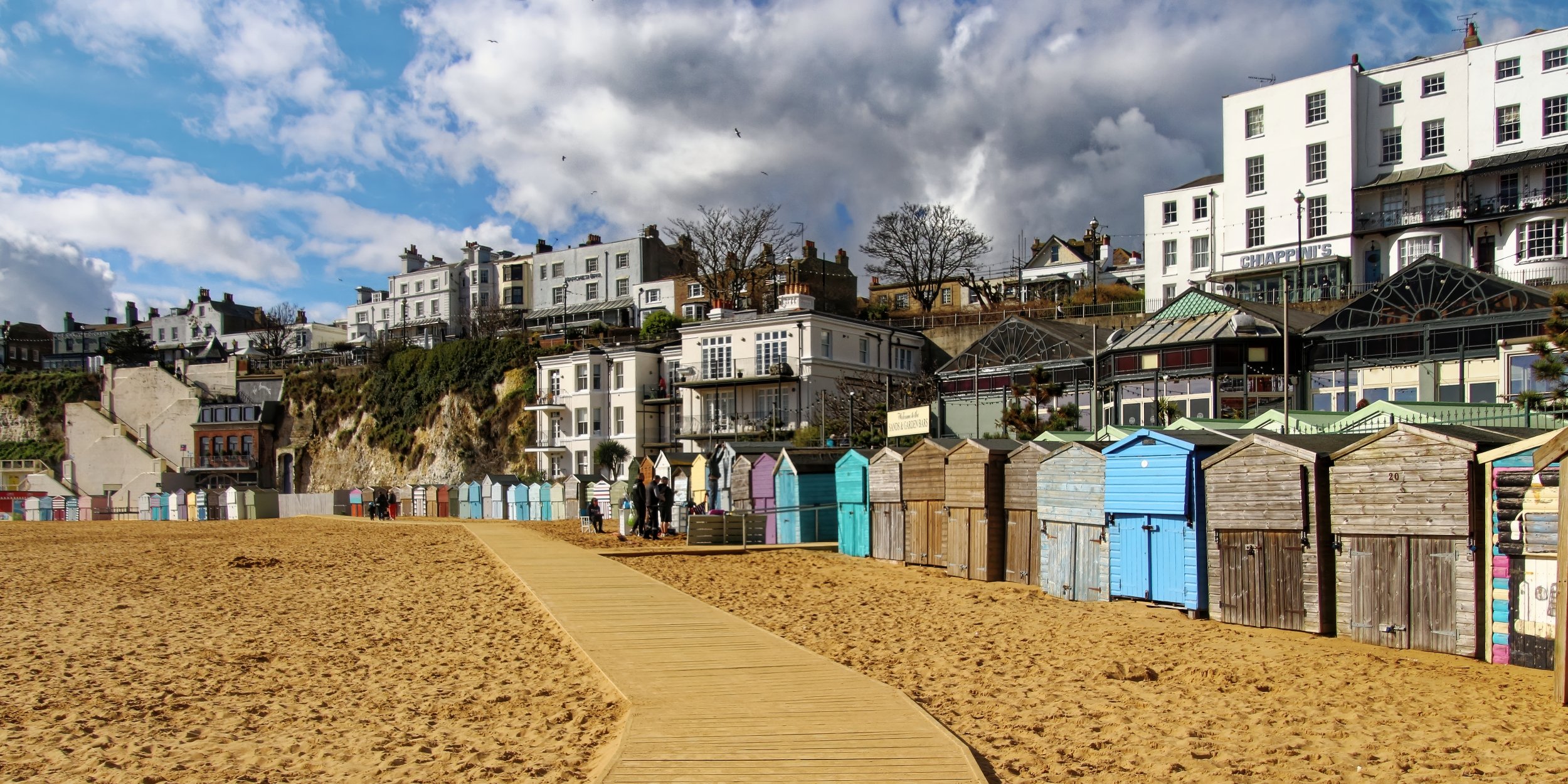 along-the-boardwalk-colourful-beach-huts-british-seaside-fine-art-photography-print.jpg