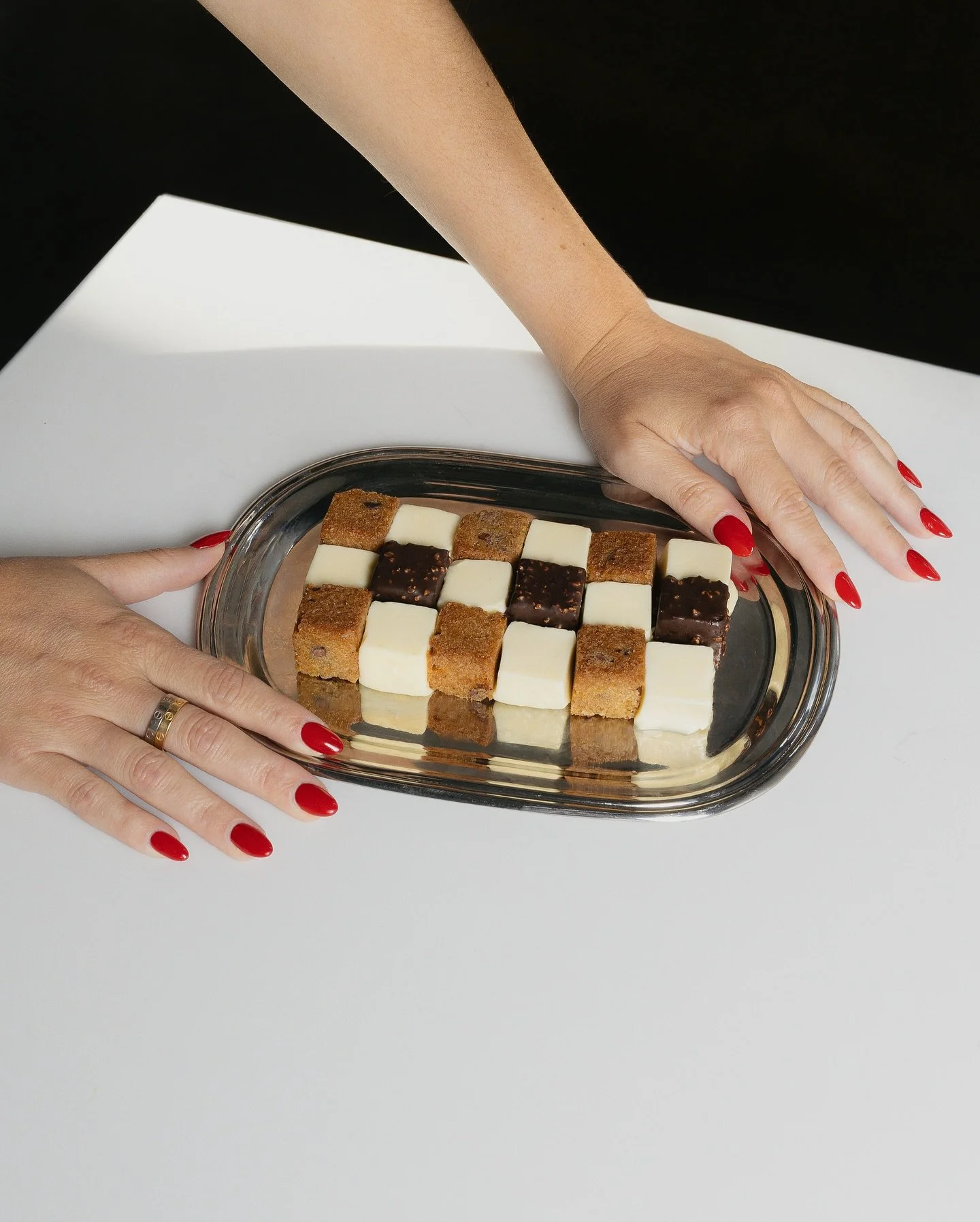 A spin on milk and cookies takes its cues from the runway&rsquo;s fascination with plaid this season. Squares of sweet milk semifreddo are stacked against brown butter chocolate chip and praline truffle, creating a tartan-like grid in dessert form.