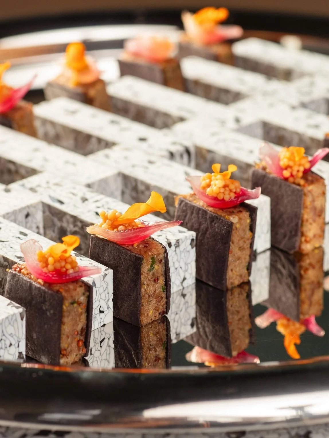 A closer look at our duck rillette. Mustard caviar, pickled pearl onion, black sable.