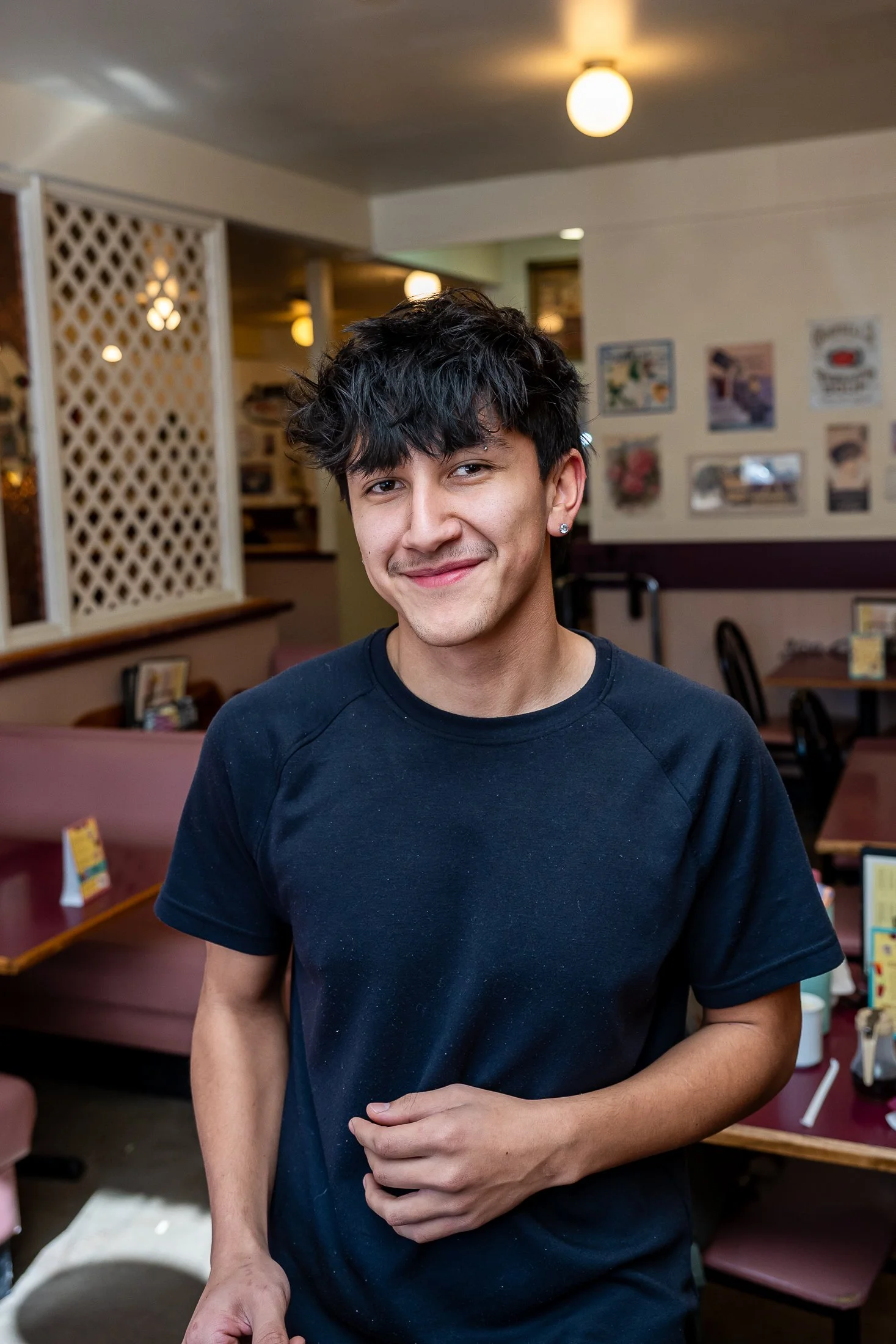 Server smiling at camera inside of The Breakfast Club Loveland, Colorado..