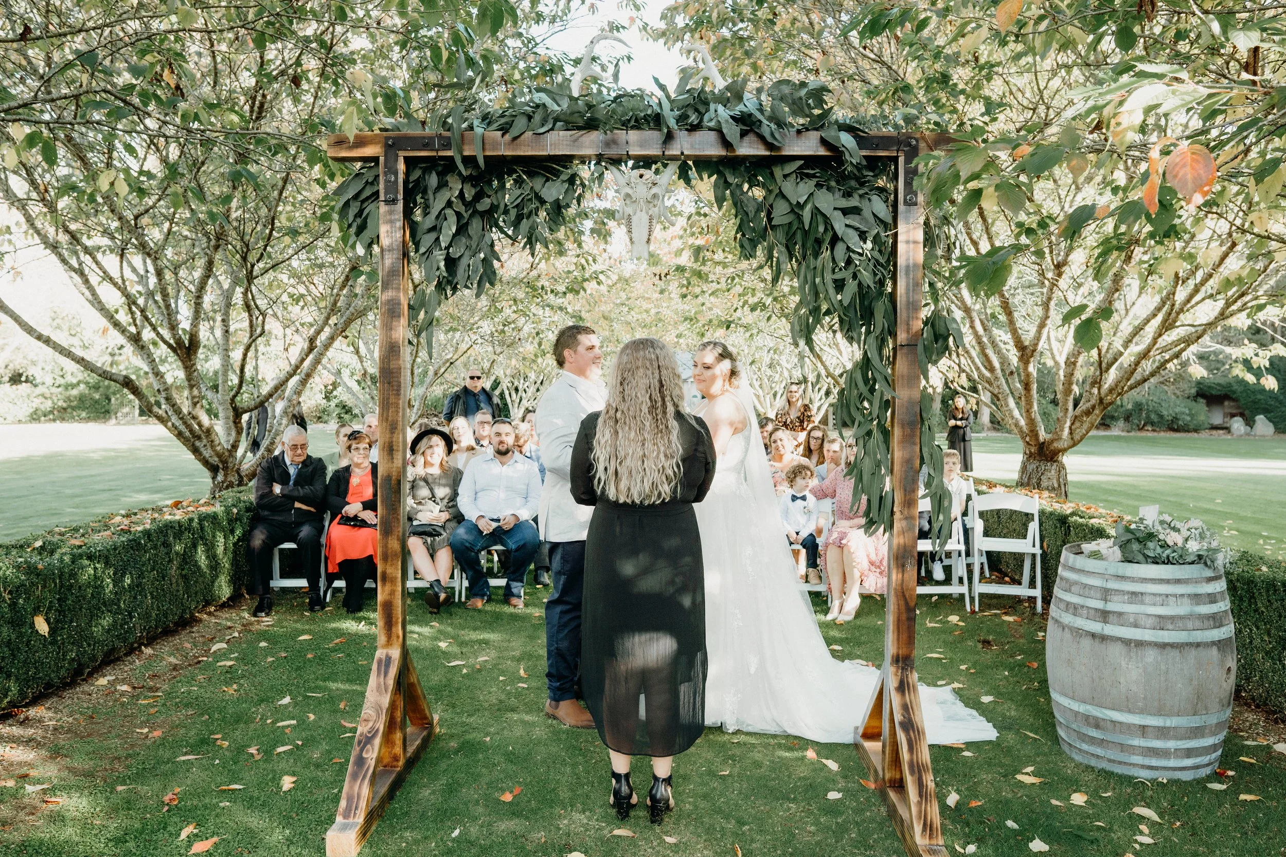 Wooden, wedding, arch, garden, rustic, timber, alter, ceremony, florals, flowers, floral arrangement, deer head