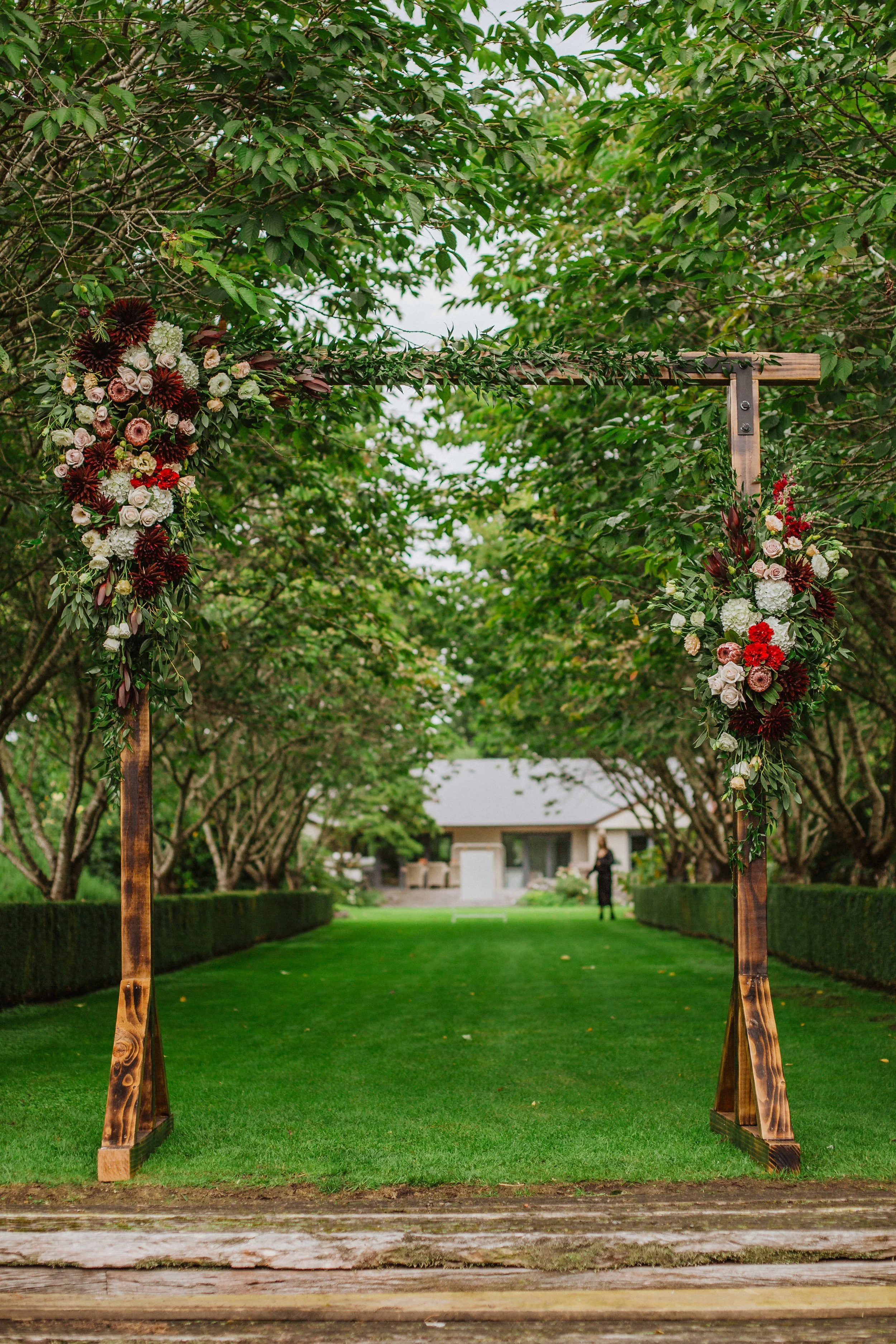 Rustic, wooden, arch, greenery, tree lane, floral arrangement