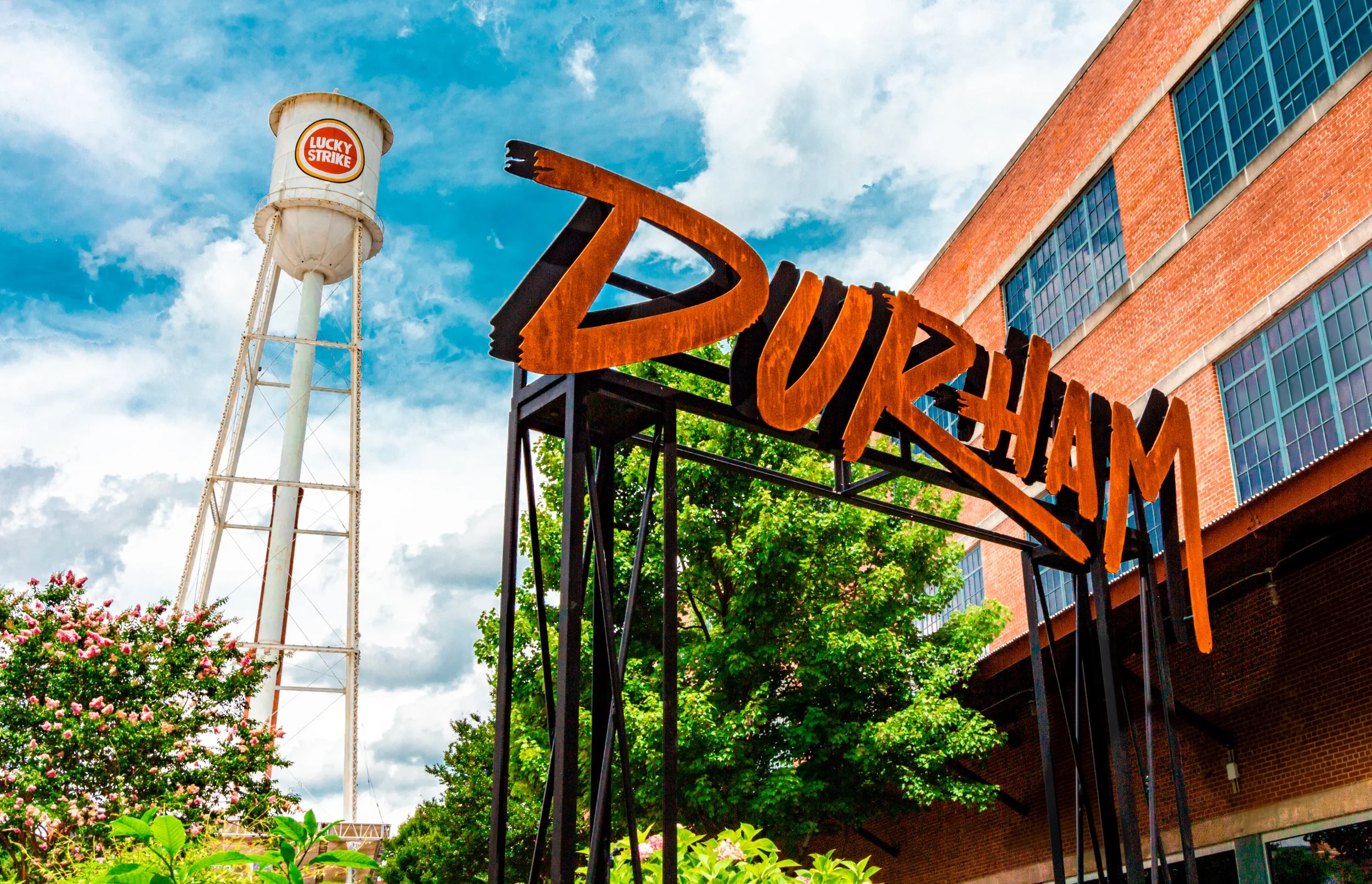 The Durham sign in front of the Lucky Strike Tower at American Tobacco Campus
