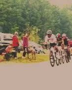 Criterium racers on bikes and spectators