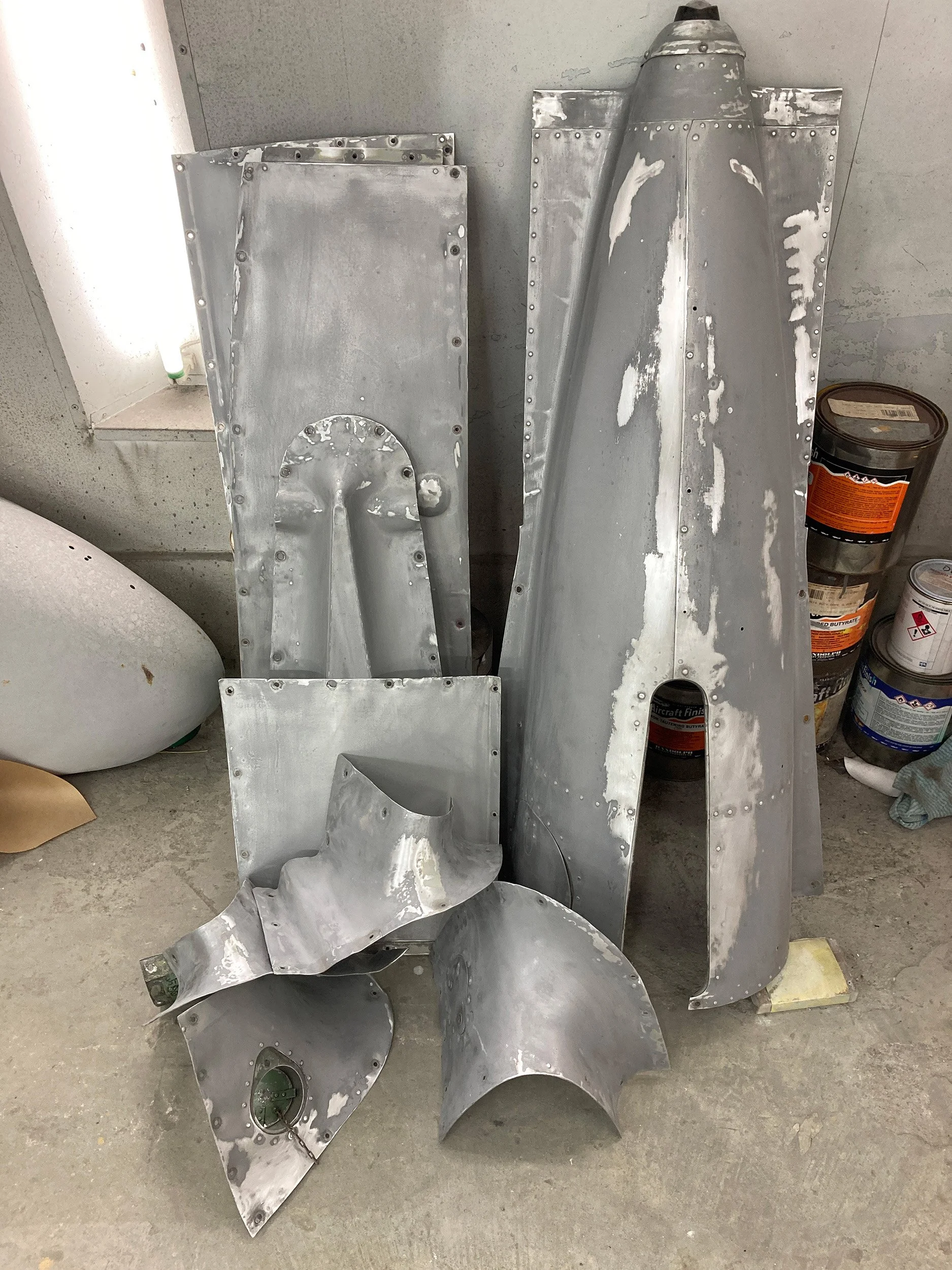 Fairing panels as removed, before stripping and painting. Some of the fairings have extremely complex shapes.