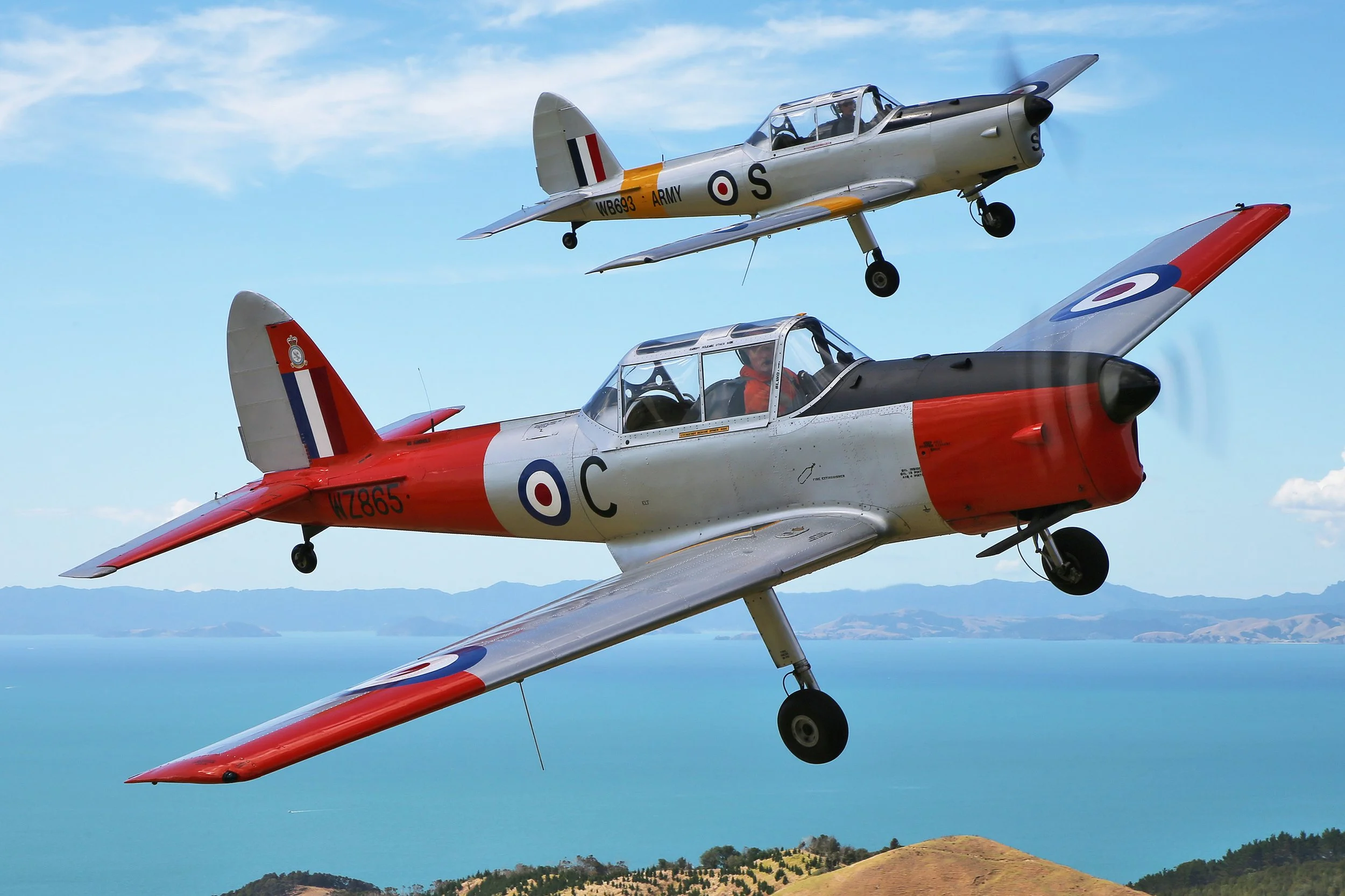 Chipmunk Blue: Chipmunk 65 leading Mike Wood's ZK-RFS ahead of the 2025 Ardmore Airshow. RFS wears the early silver and yellow RAF/Army colour scheme.