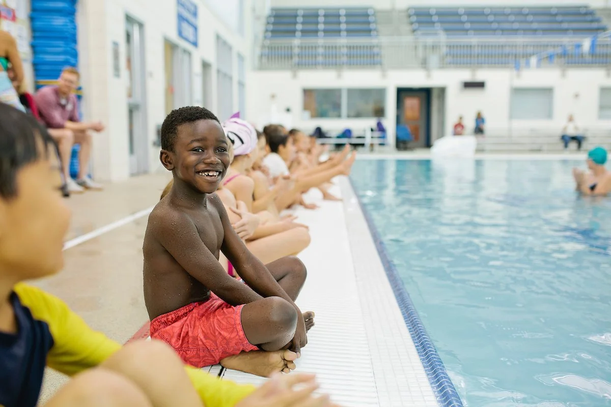boy in swim lessons, commercial photography for school disctricts