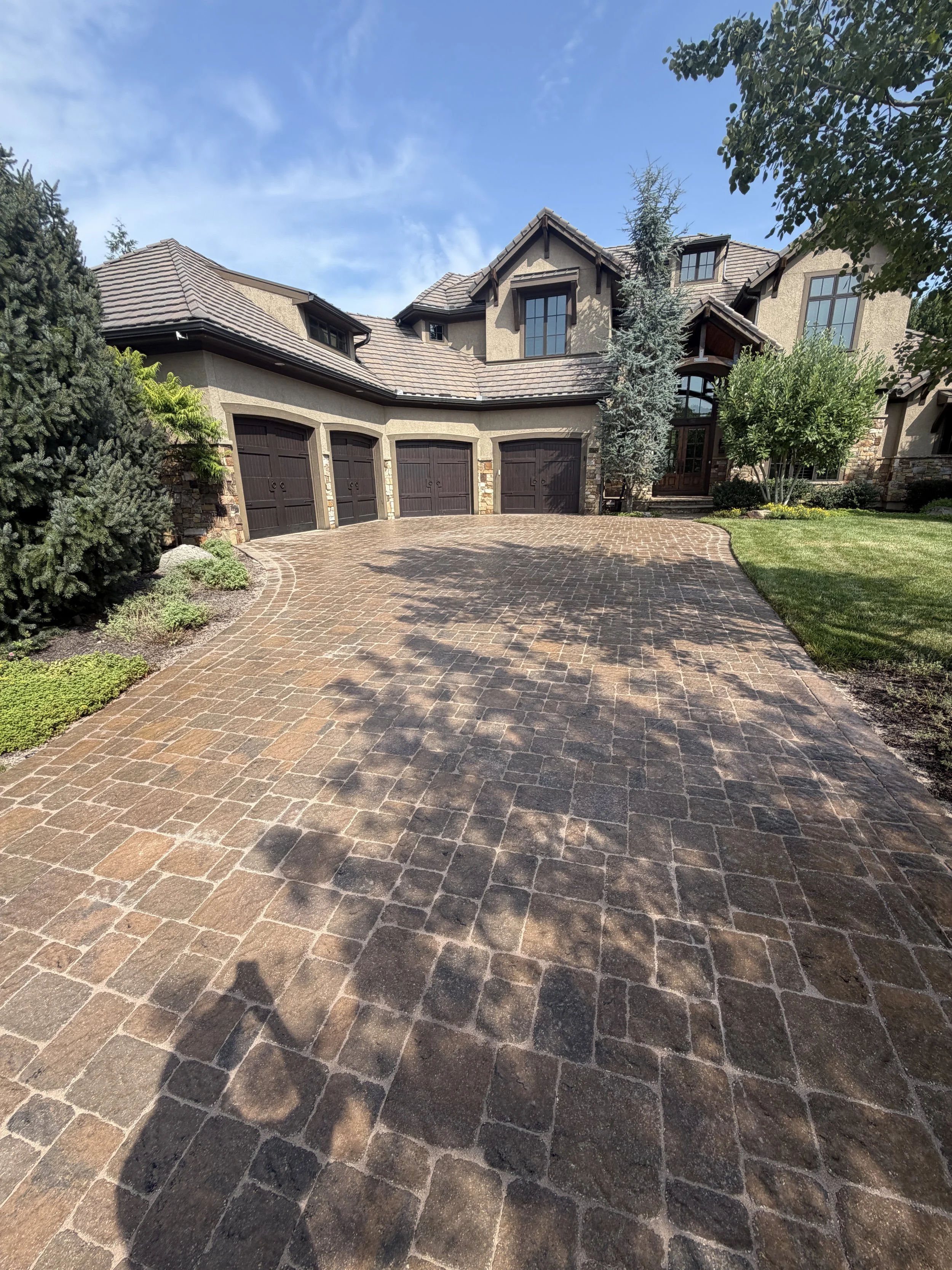 Paver Resotration, Professional Power Washing, and Sealing on a Paver Driveway in Leawood, KS