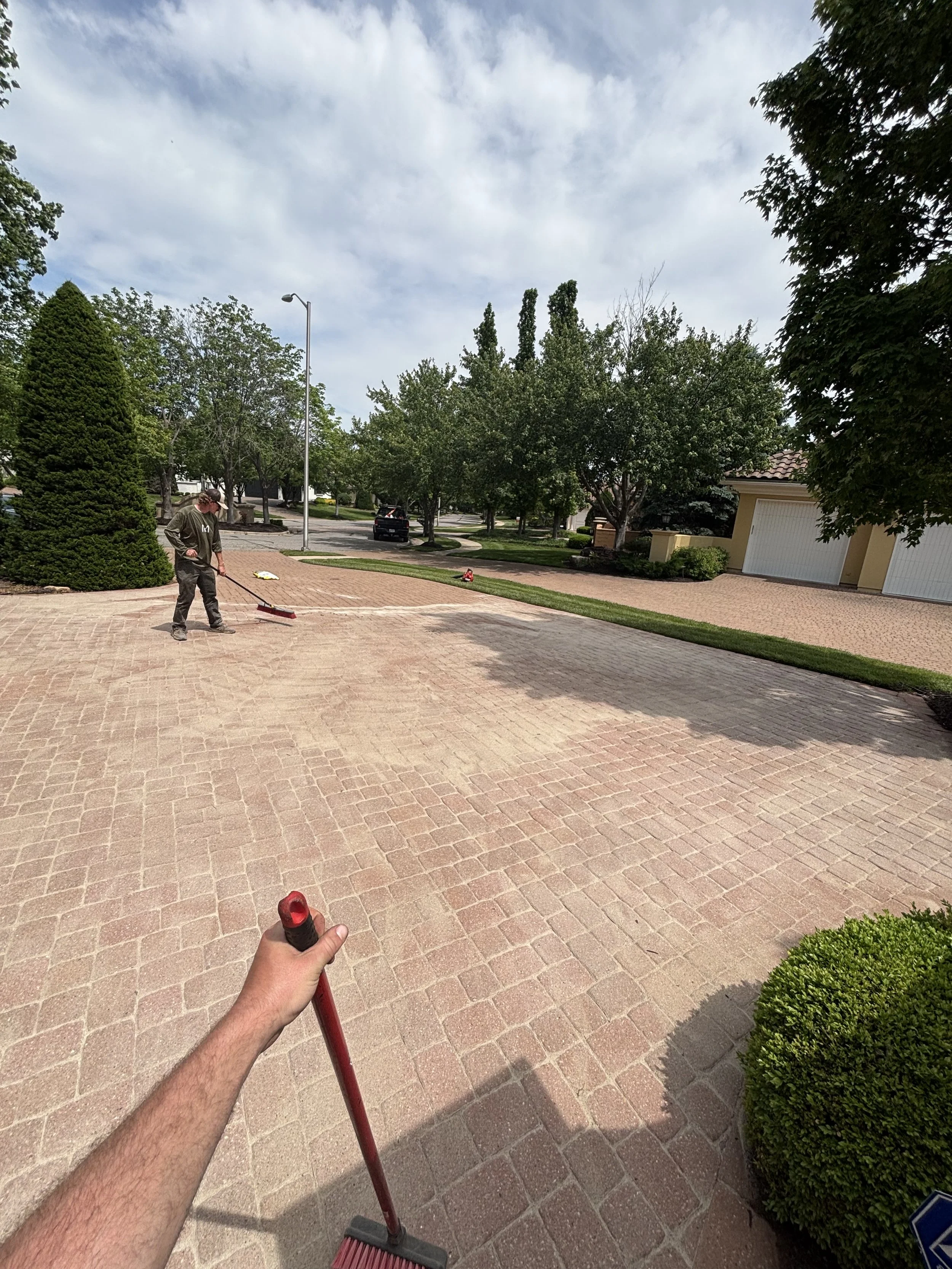 Installing Fresh Polymeric Sand on a Paver Driveway in Leawood KS