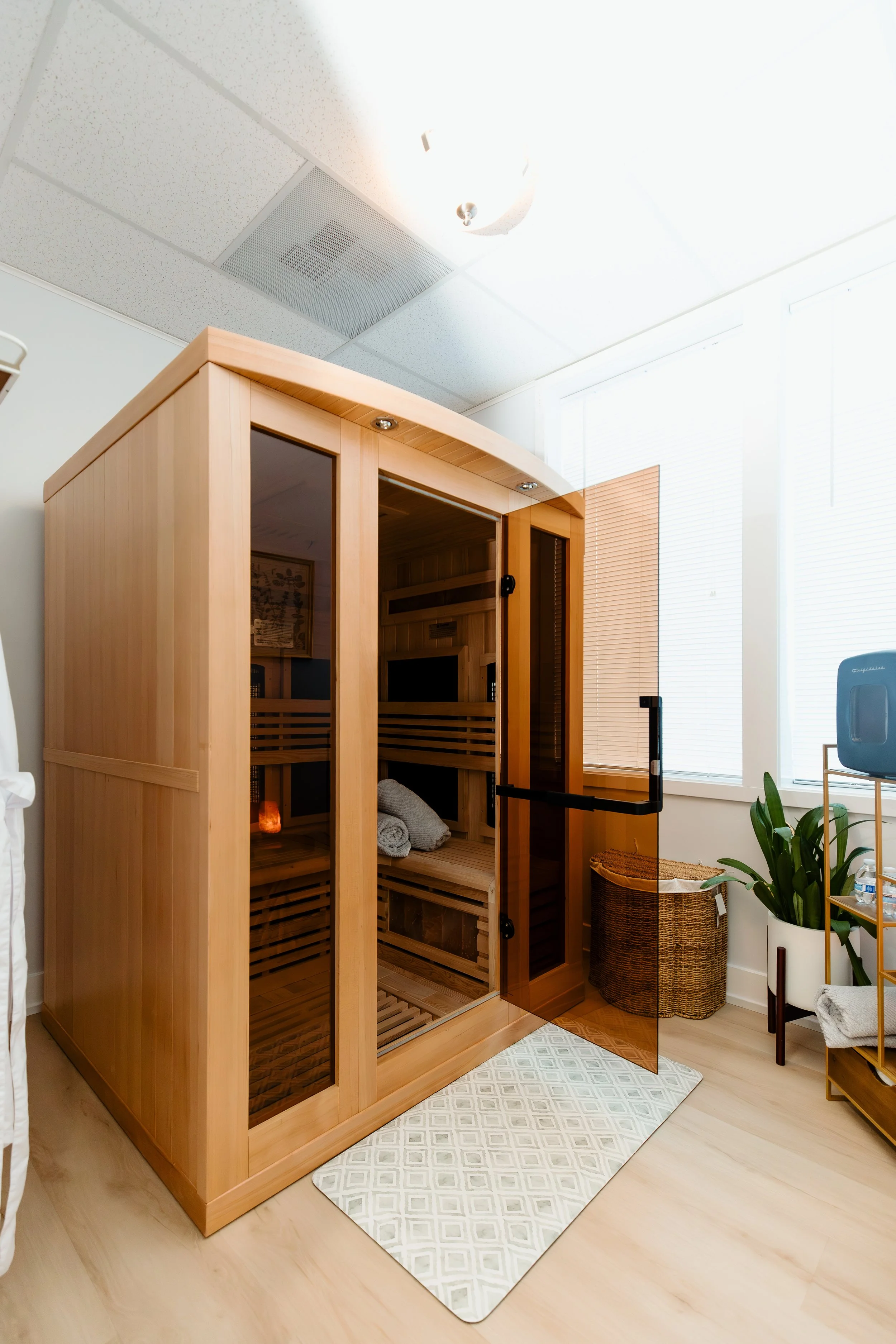 Broad spectrum infrared sauna with door open and salt lamp