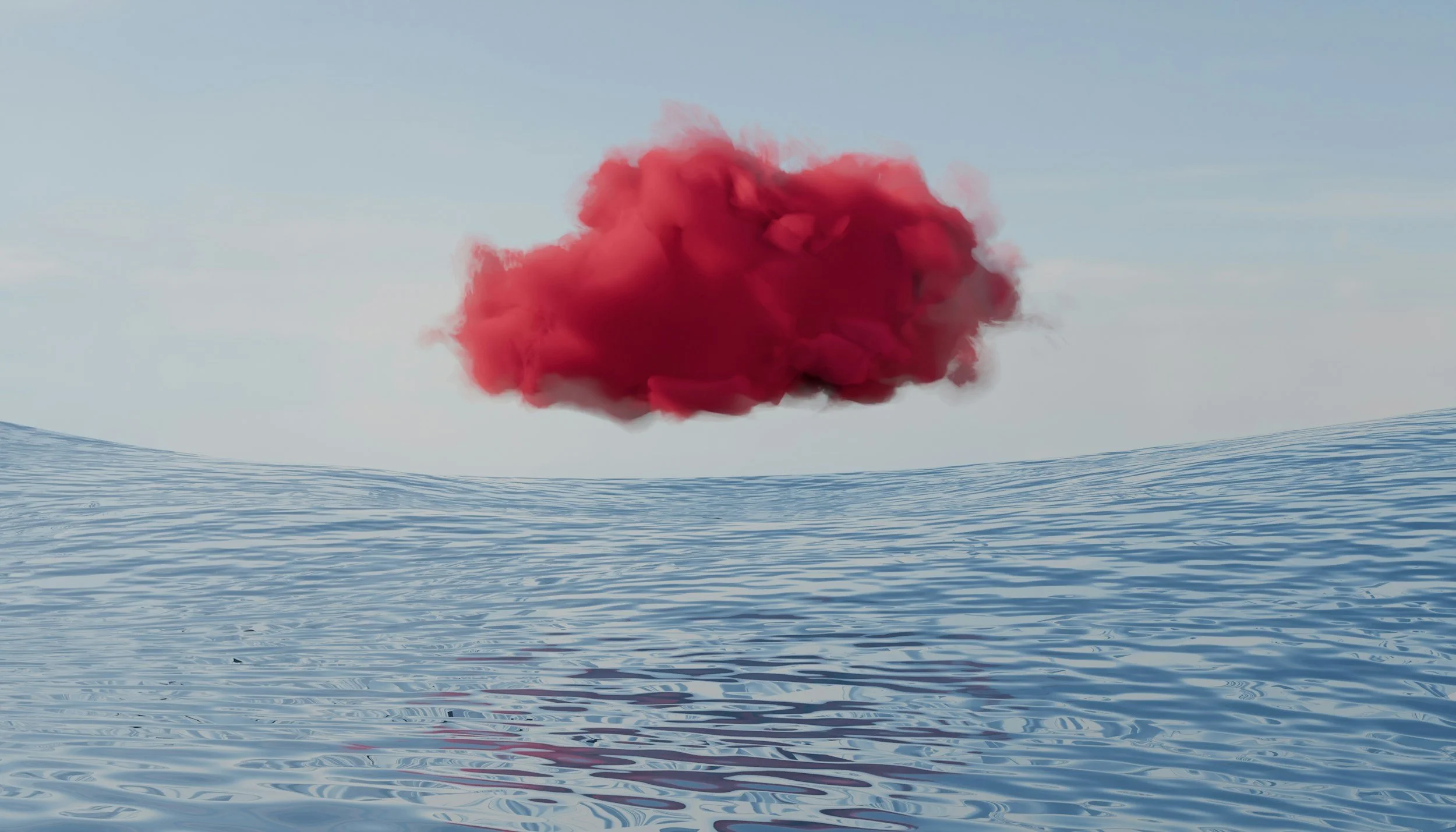 A large red smoke cloud rising above a calm body of water under a clear sky.