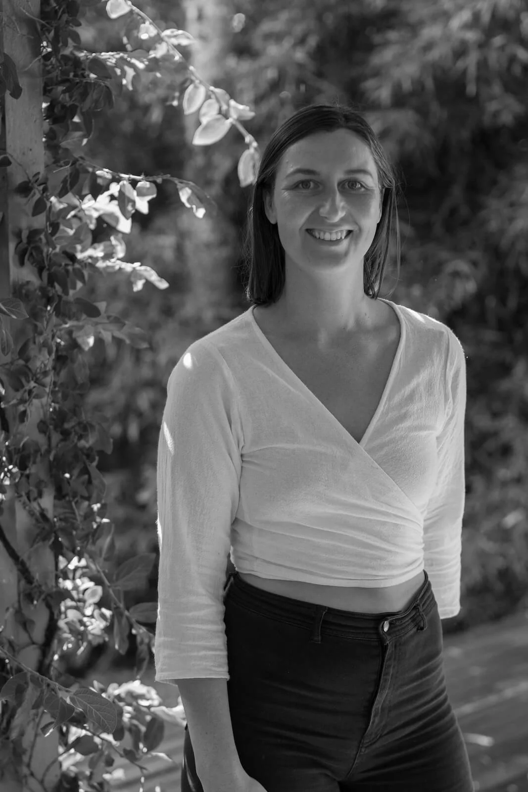 Katelyn Byron Craniosacral therapist and remedial massage therapist standing outside at Byron Health Studio located in Ocean Shores.