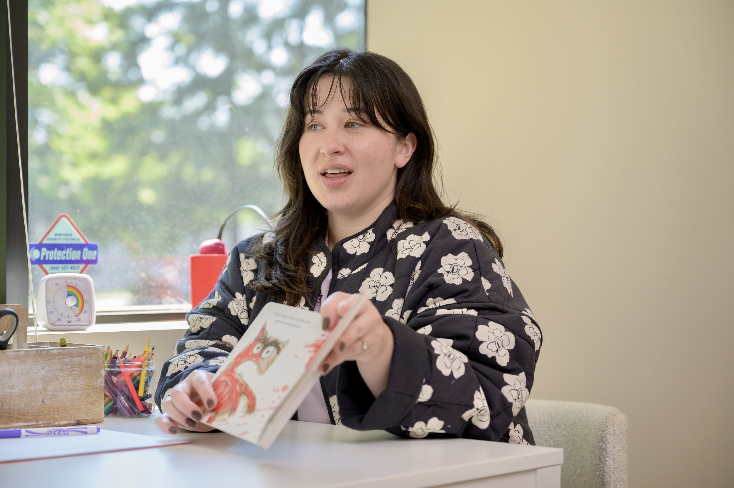 Clinician Anna helping clients learn about themselves through stories!