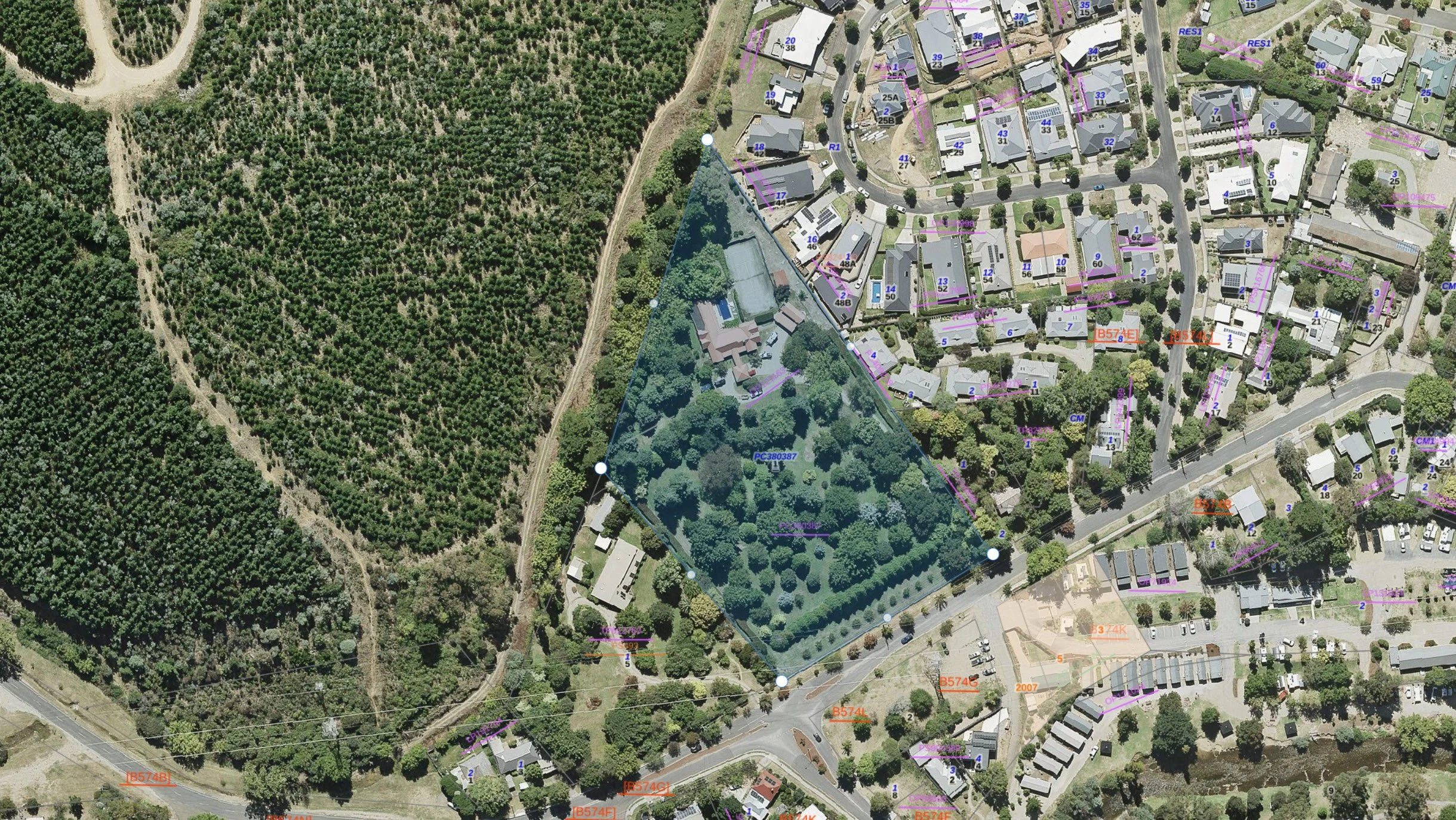 Aerial view of adjacent land parcels being assessed for title consolidation