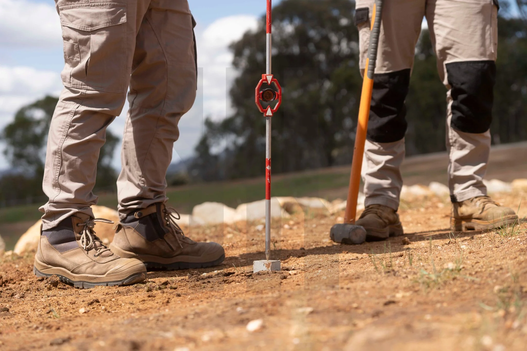 Surveyor marking a cadastral boundary