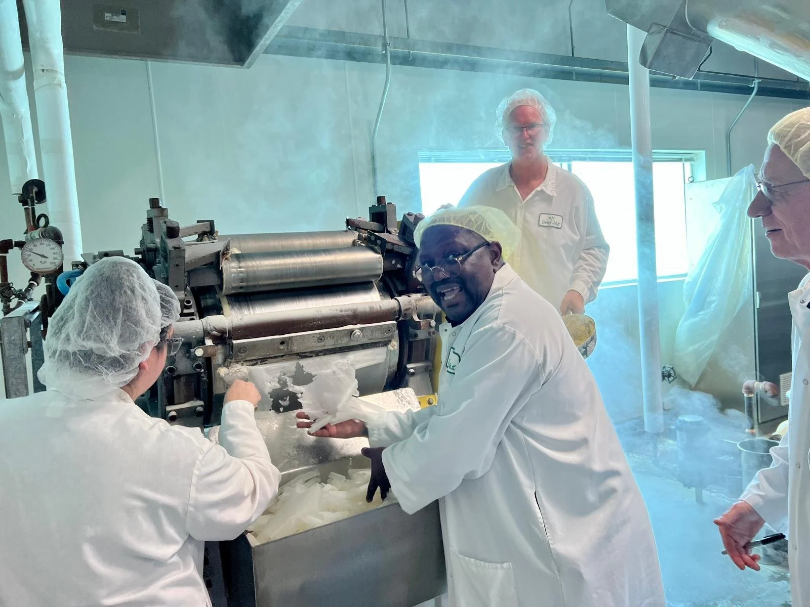 Food science expert Dr. Tony Bello working in a food science laboratory processing cassava root samples
