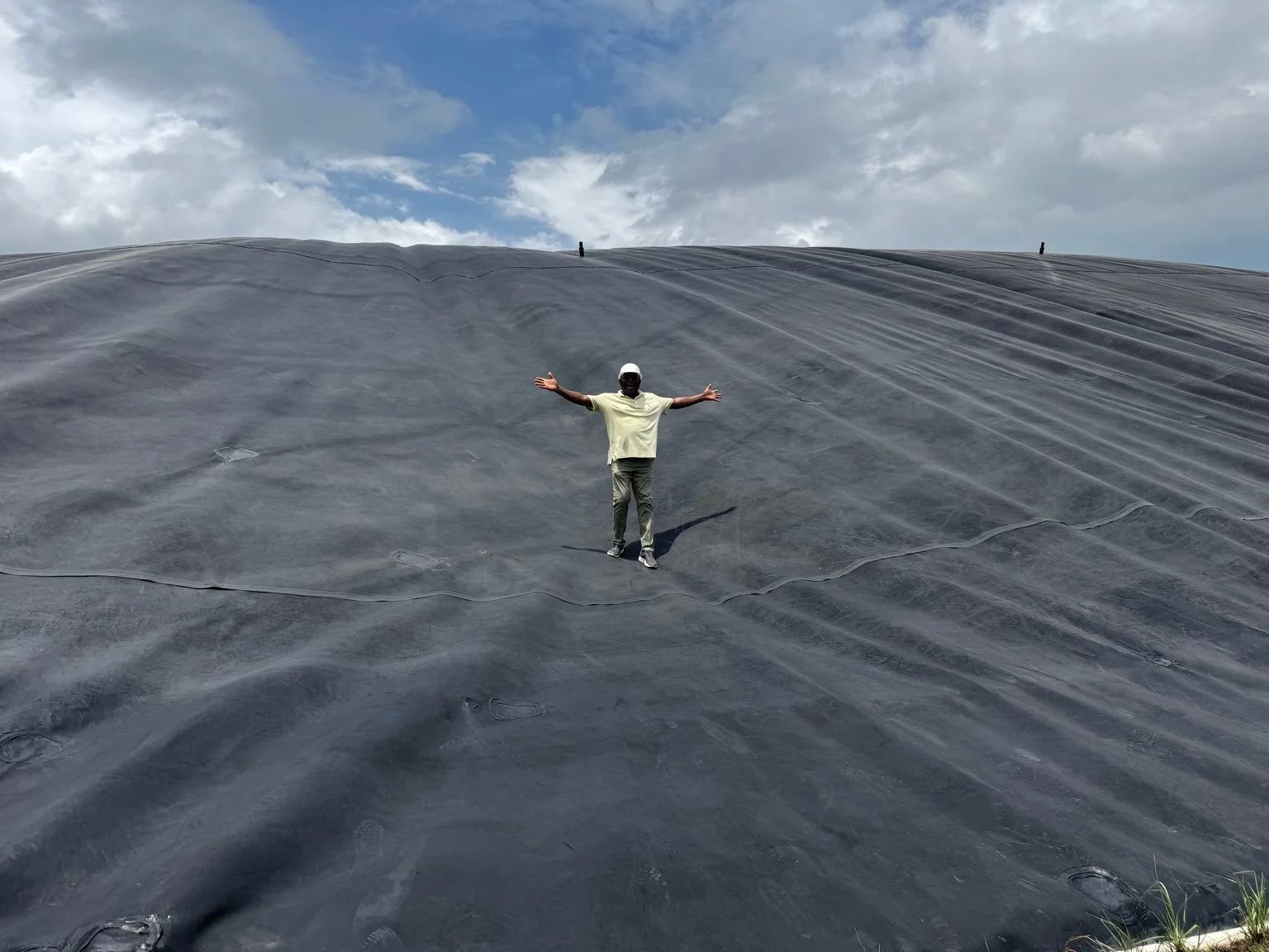 Standing atop a sealed bio-digester dome—part of an integrated starch production and energy efficiency system aligned with Shine Bridge’s ESG vision.