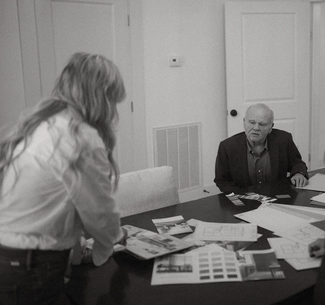 Picture of Erica and Steve of Opulent Properties having a meeting regarding a home renovation