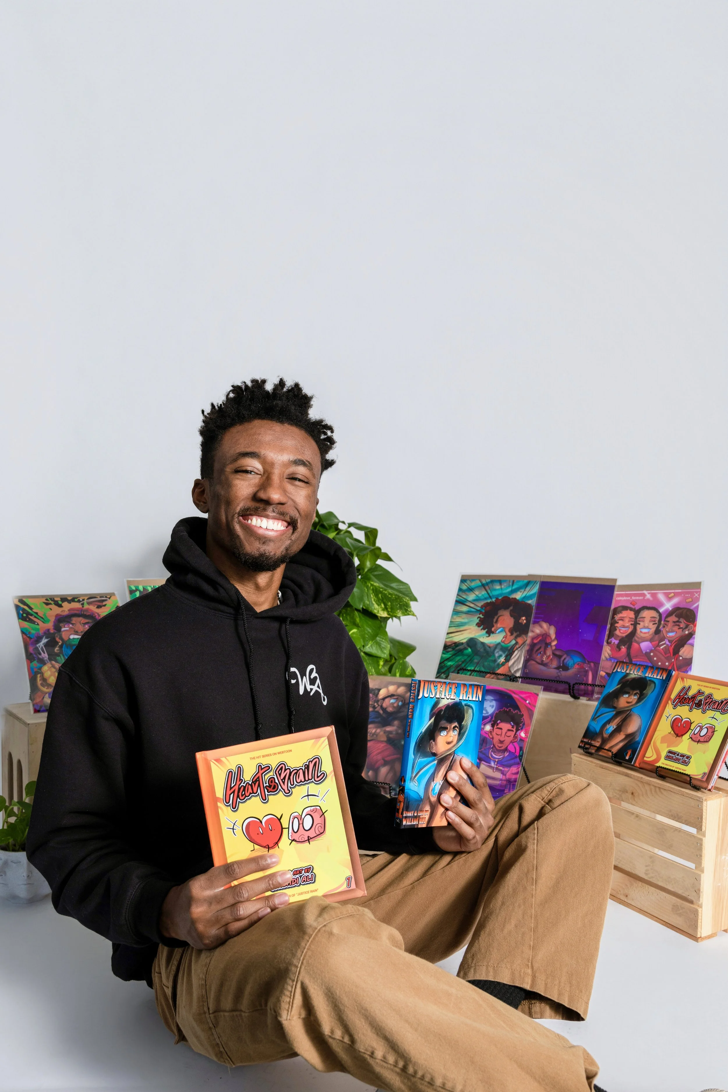 Artist posing with his original artwork photographed at No Bounds studio in Denver Colorado