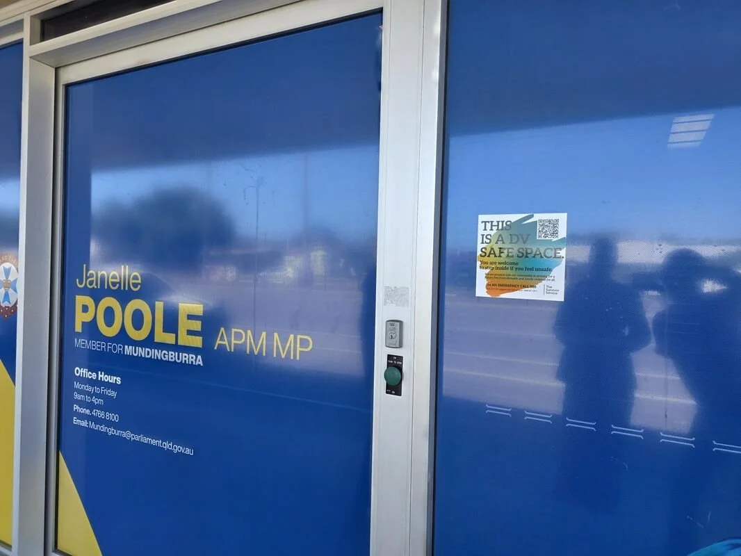 Photo of the front doors of a DV Safe Space location showing the branded sticker.