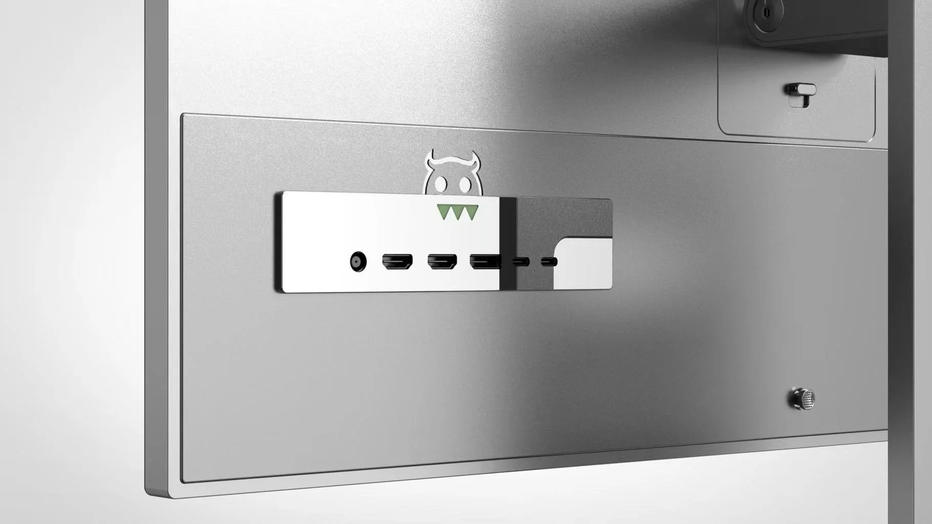 Close-up of a computer tower with a sticker of a cartoon devil face and a port panel with various ports.