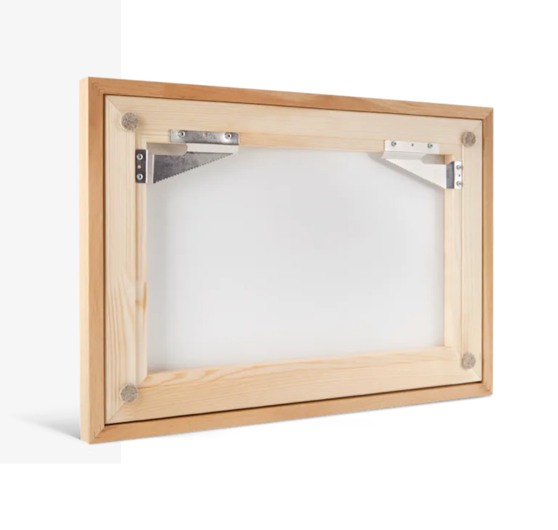Wooden picture frame with metal corner braces and felt pads on the back for wall hanging.