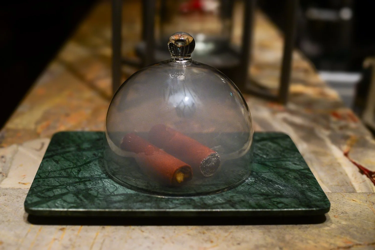  Cigar Leaf Smoked cherry root and crispy potato crust; lined with a green apple gel sheet and filled with cucumber black sesame ash 