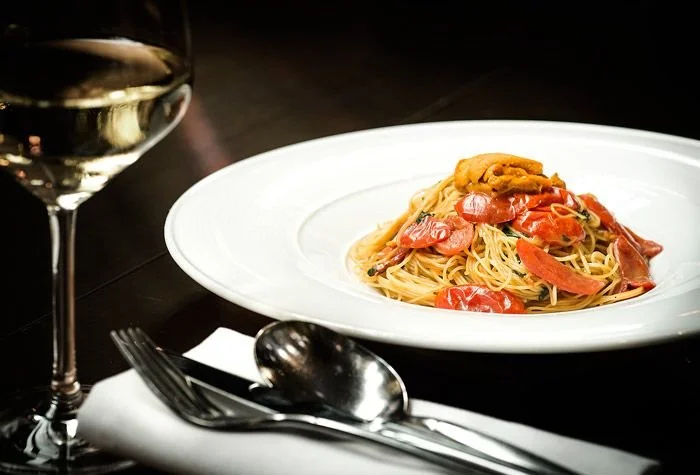 Angel Hair with sea urchin, cherry tomatoes, and garlic chips 