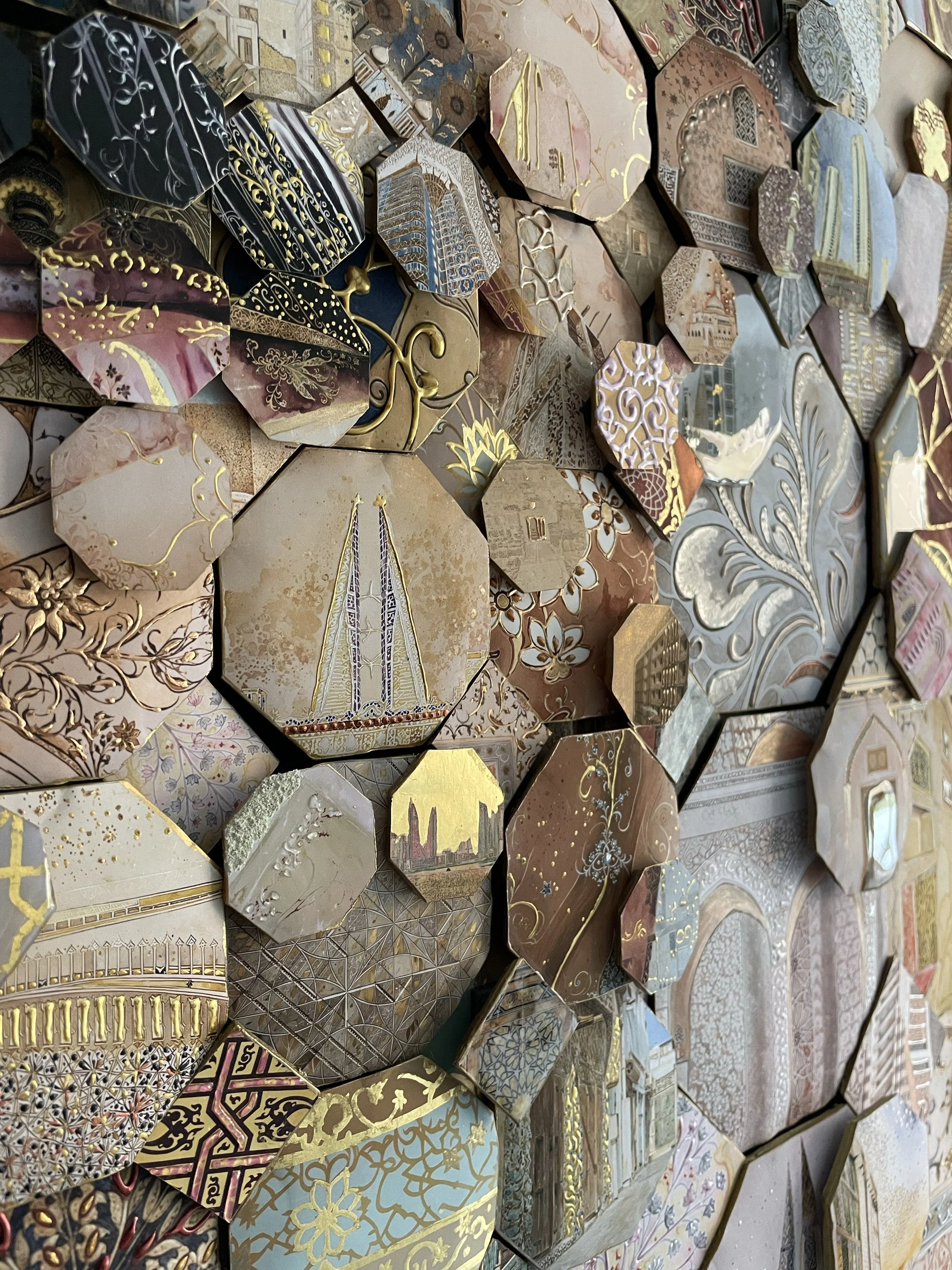 Mosaic of octagonal tiles with skyscrapers, floral engravings, gold lines and ornate patterns in warm earthy tones