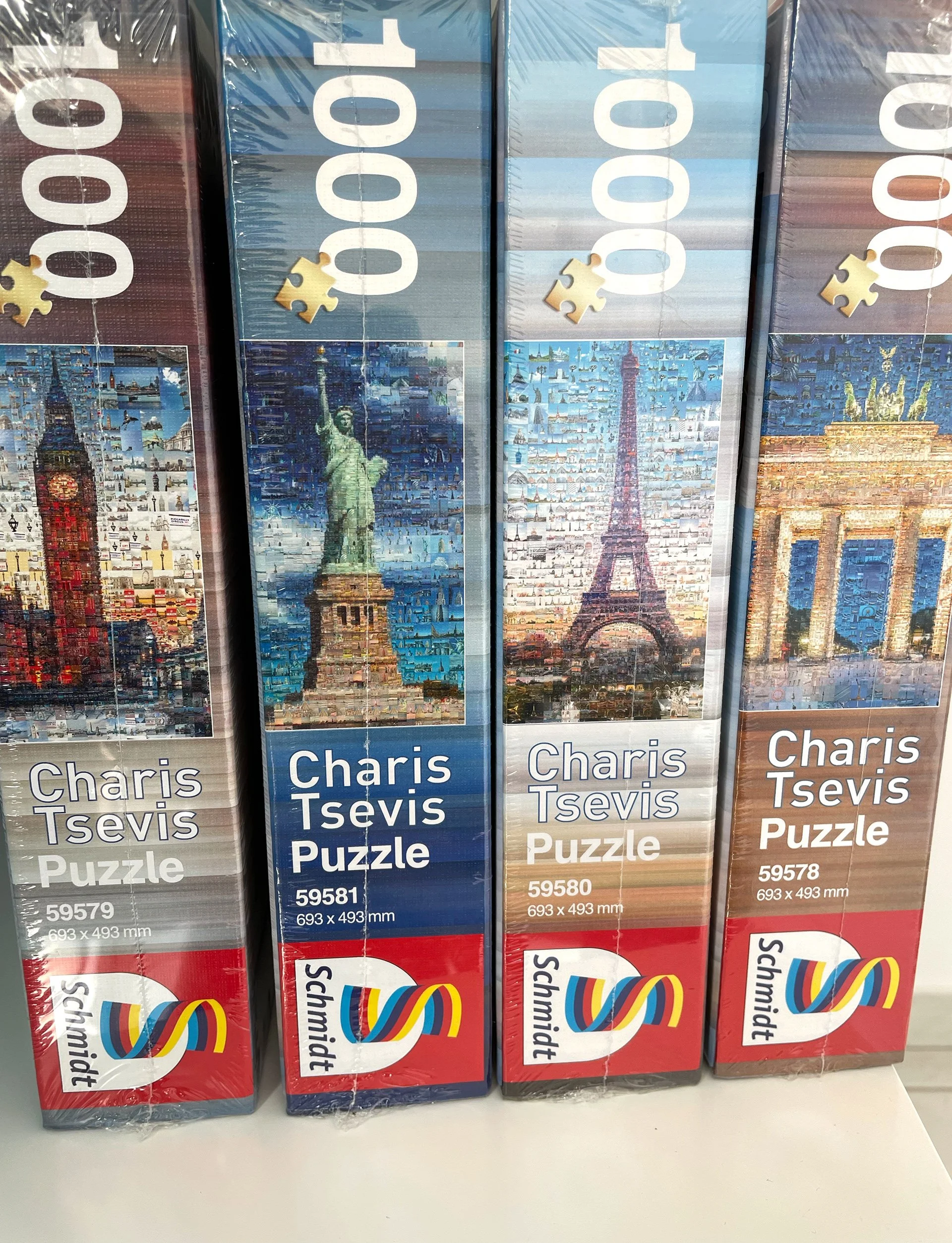 Four boxed 1000-piece Schmidt puzzles with mosaics of Big Ben, Statue of Liberty, Eiffel Tower and Brandenburg Gate 