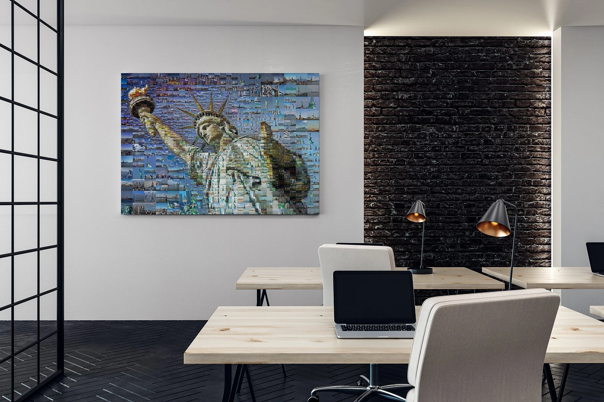  Mosaic of the Statue of Liberty on an office wall above wooden desks, a laptop and desk lamps 