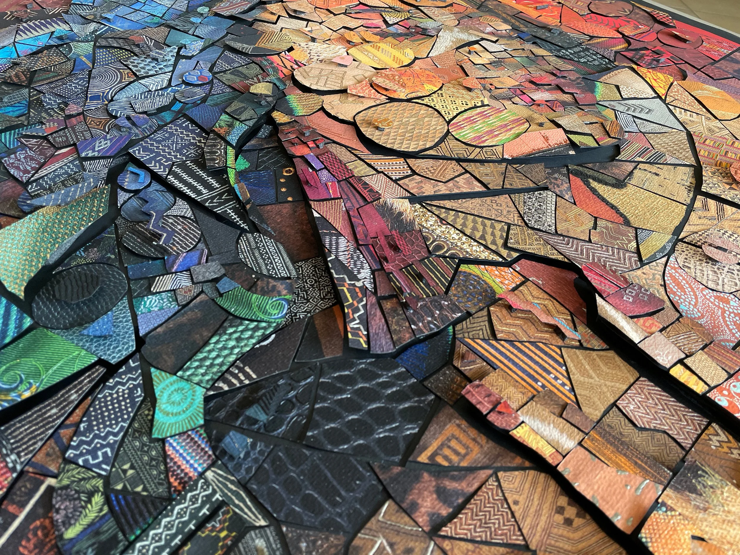  hand-cutting individual paper tiles for the analog version of The African Bricks 