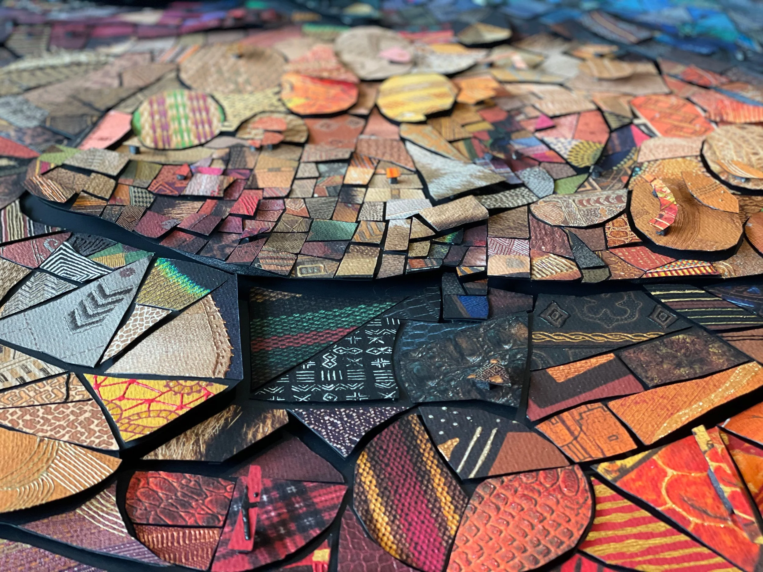 hand-cutting individual paper tiles for the analog version of The African Bricks 