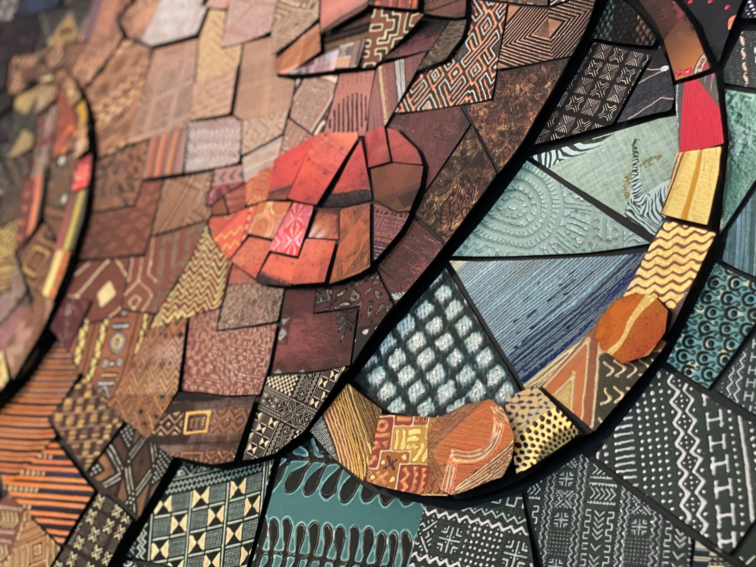  hand-cutting individual paper tiles for the analog version of The African Bricks 