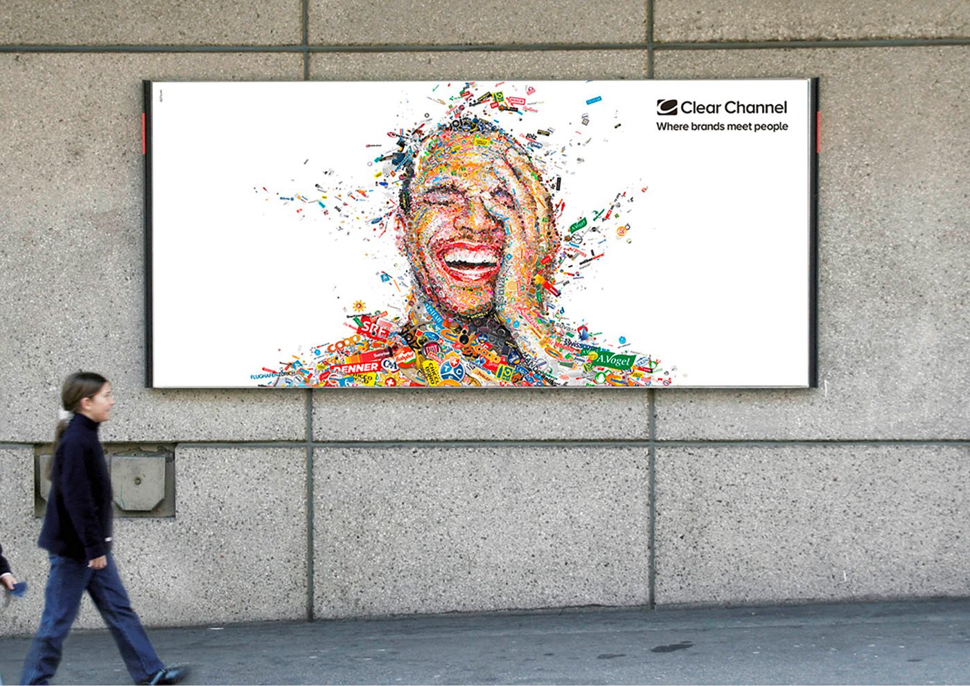   Billboard installation – Swiss commuters passing logo mosaic advertisement.  