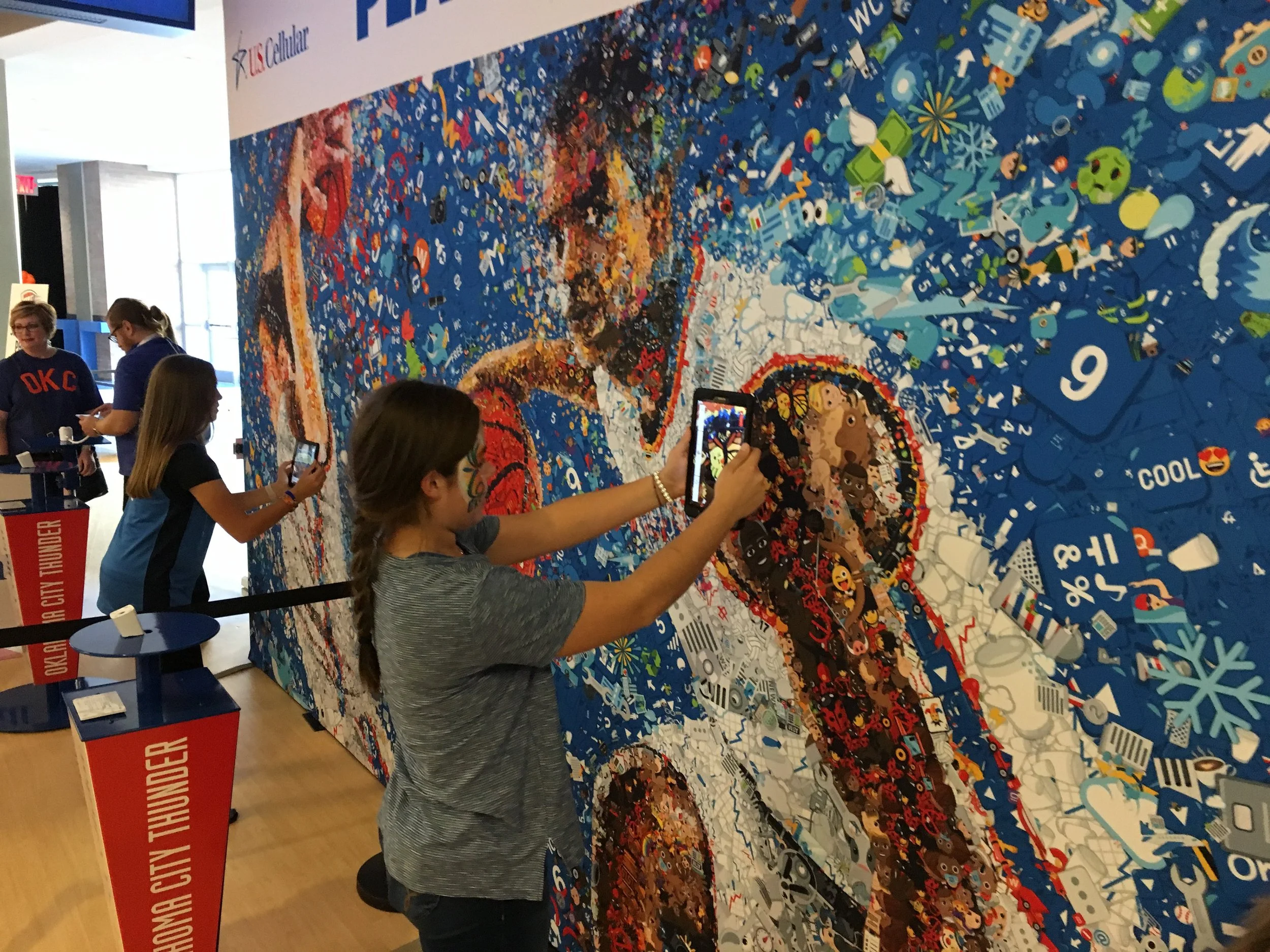   US Cellular stand with OKC Thunder emoji mosaics – Chesapeake Energy Arena. Interactive fan zone.  