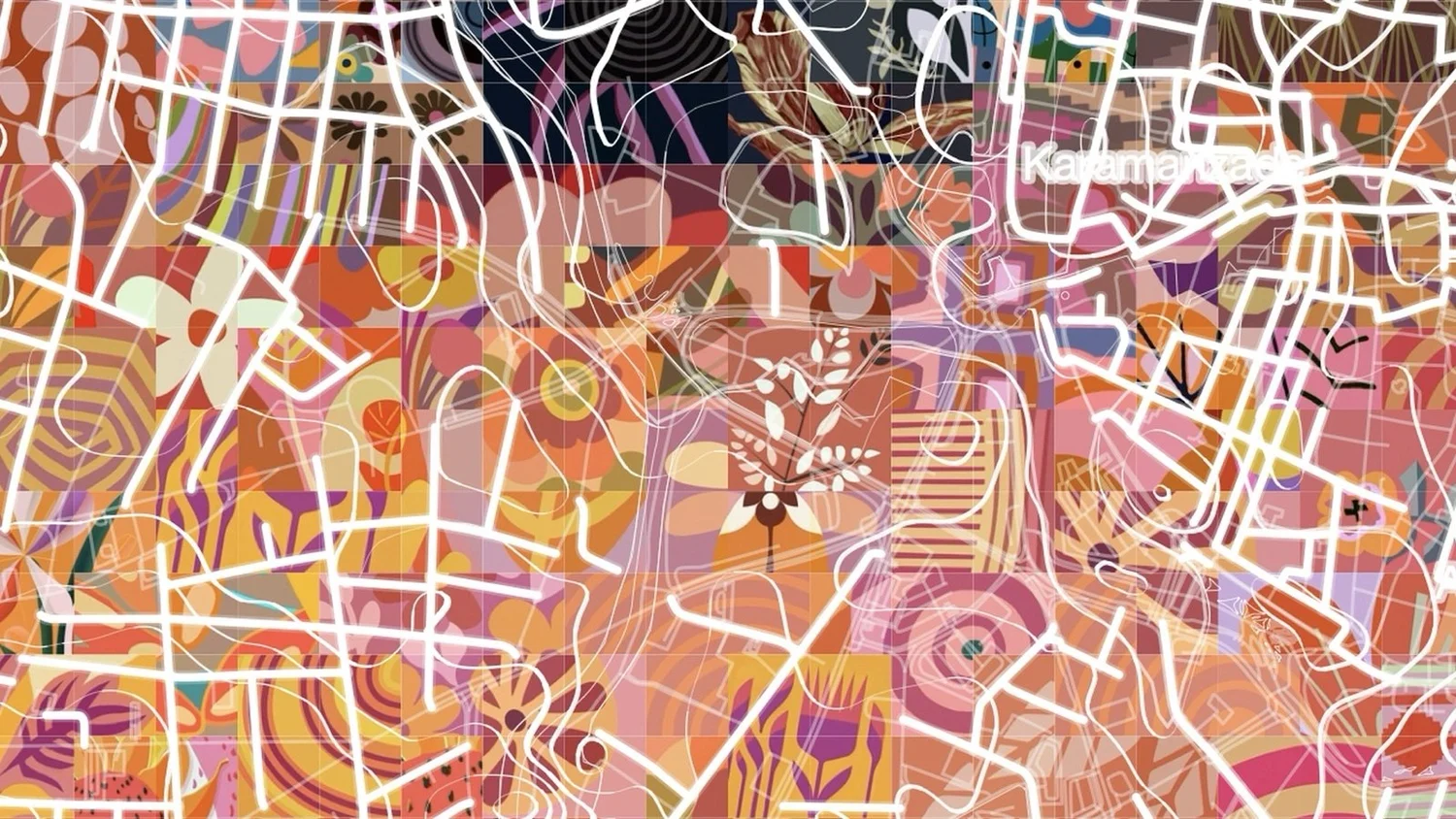 Detail of a mosaic in warm pinks, oranges and reds, where white lines tracing the street plan of Nicosia cut the surface into tiles filled with floral and geometric patterns.