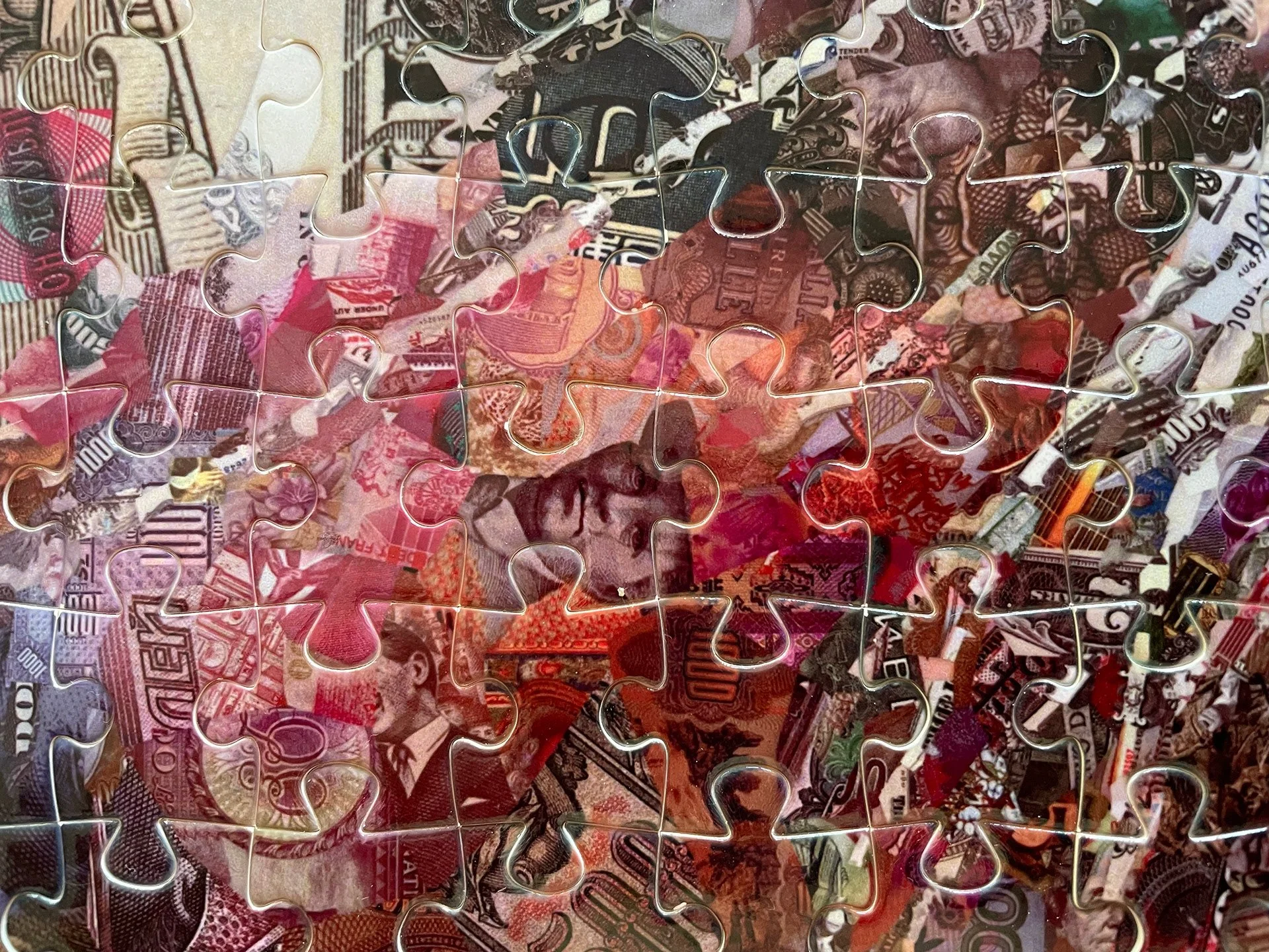 tsevis-global-currency-puzzle-close-glossy-reflections.jpg