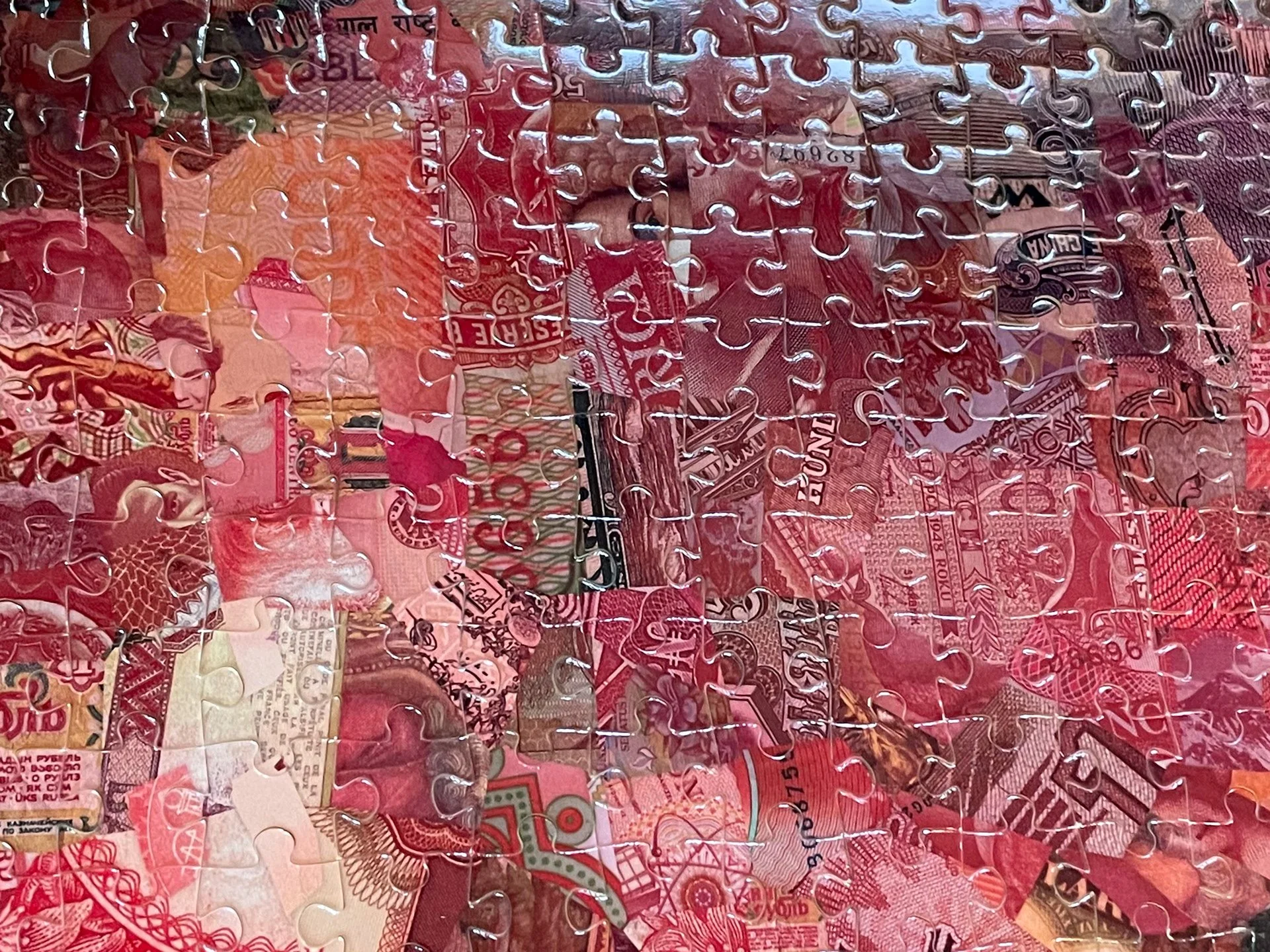tsevis-incomplete-puzzle-global-currencies-warm-tones.jpg