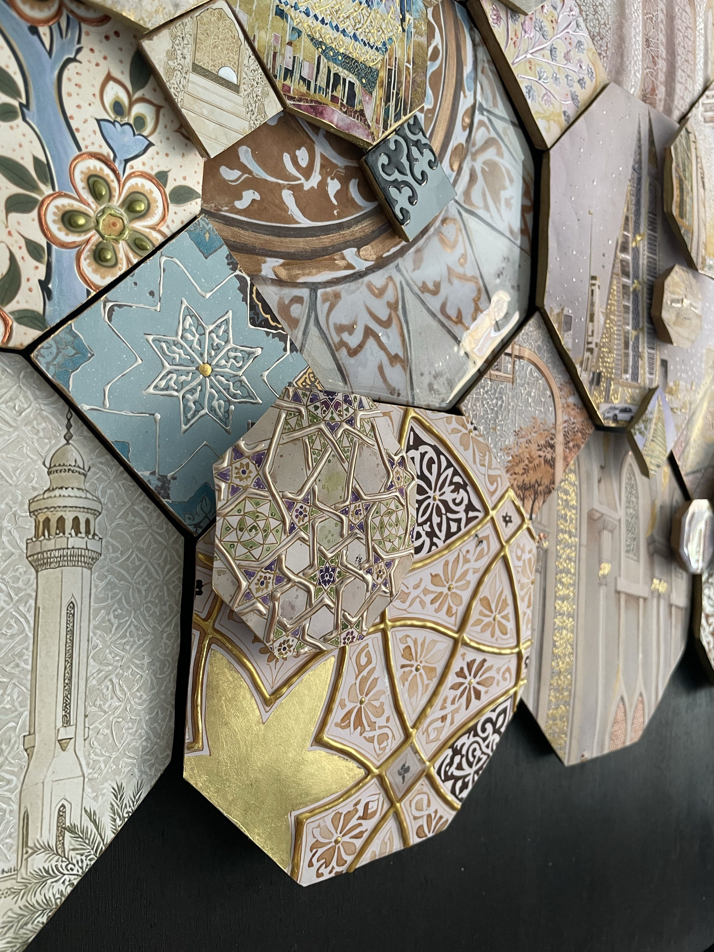Close-up of layered octagonal tiles with a minaret, star patterns, floral motifs and gold leaf on a dark background