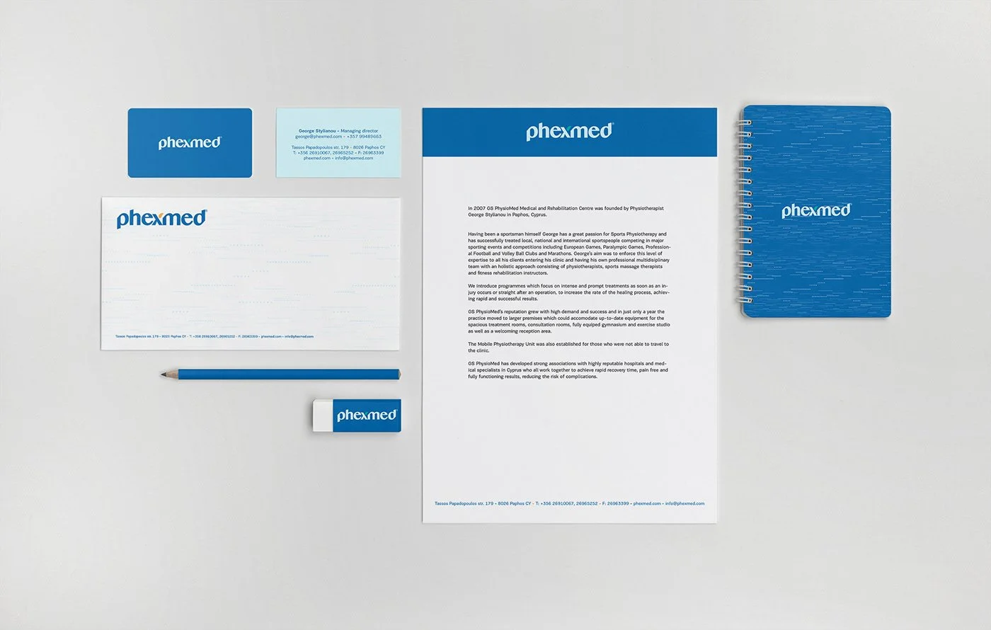 Phexmed brand stationery mockup – business cards, letterhead, envelopes with horizon logo and earthy color palette. Designed by Charis Tsevis.