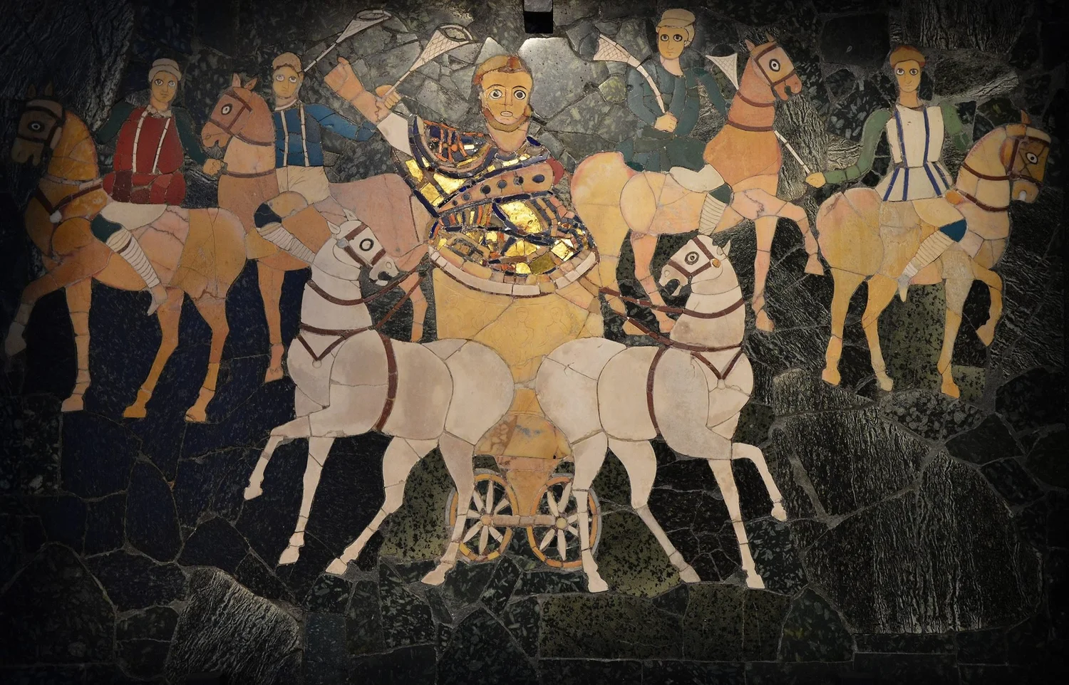 Roman inlay of cut coloured stone showing a consul in a chariot drawn by white horses, with riders