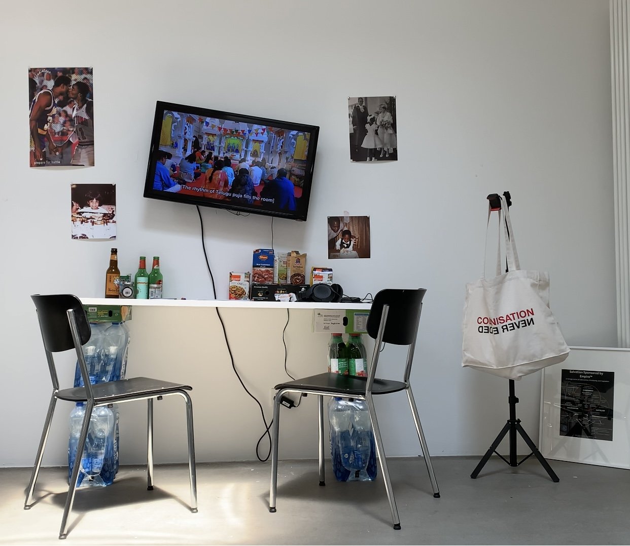 Installation view of The Hands of Gods at Art Basel 2025, featuring film, domestic objects, archival imagery, and ritual materials exploring Black × Brown memory and cultural inheritance.