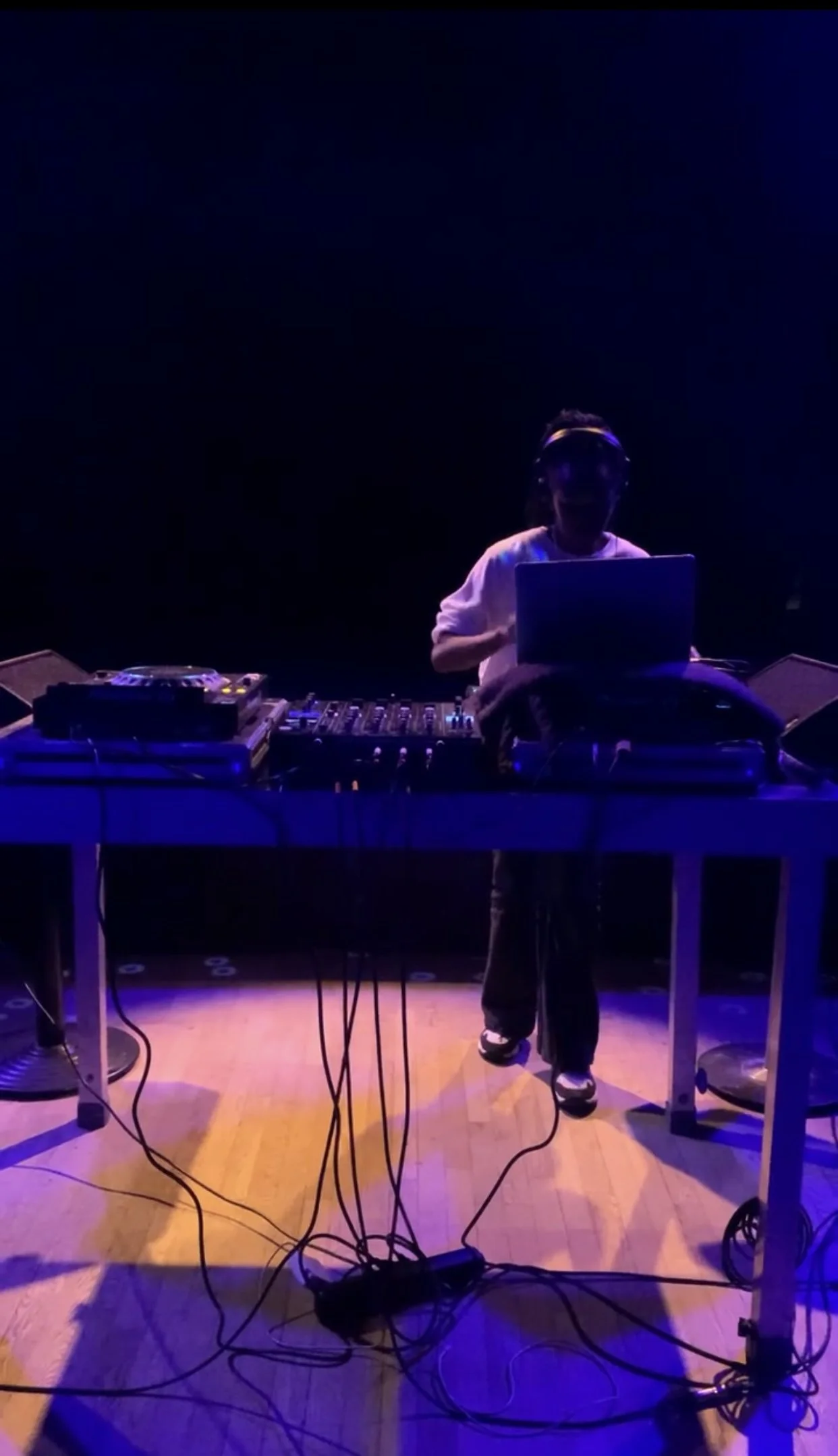 DJ performing during Vibrations of Blackness, using sound and rhythm to shape the gathering’s ritual atmosphere.