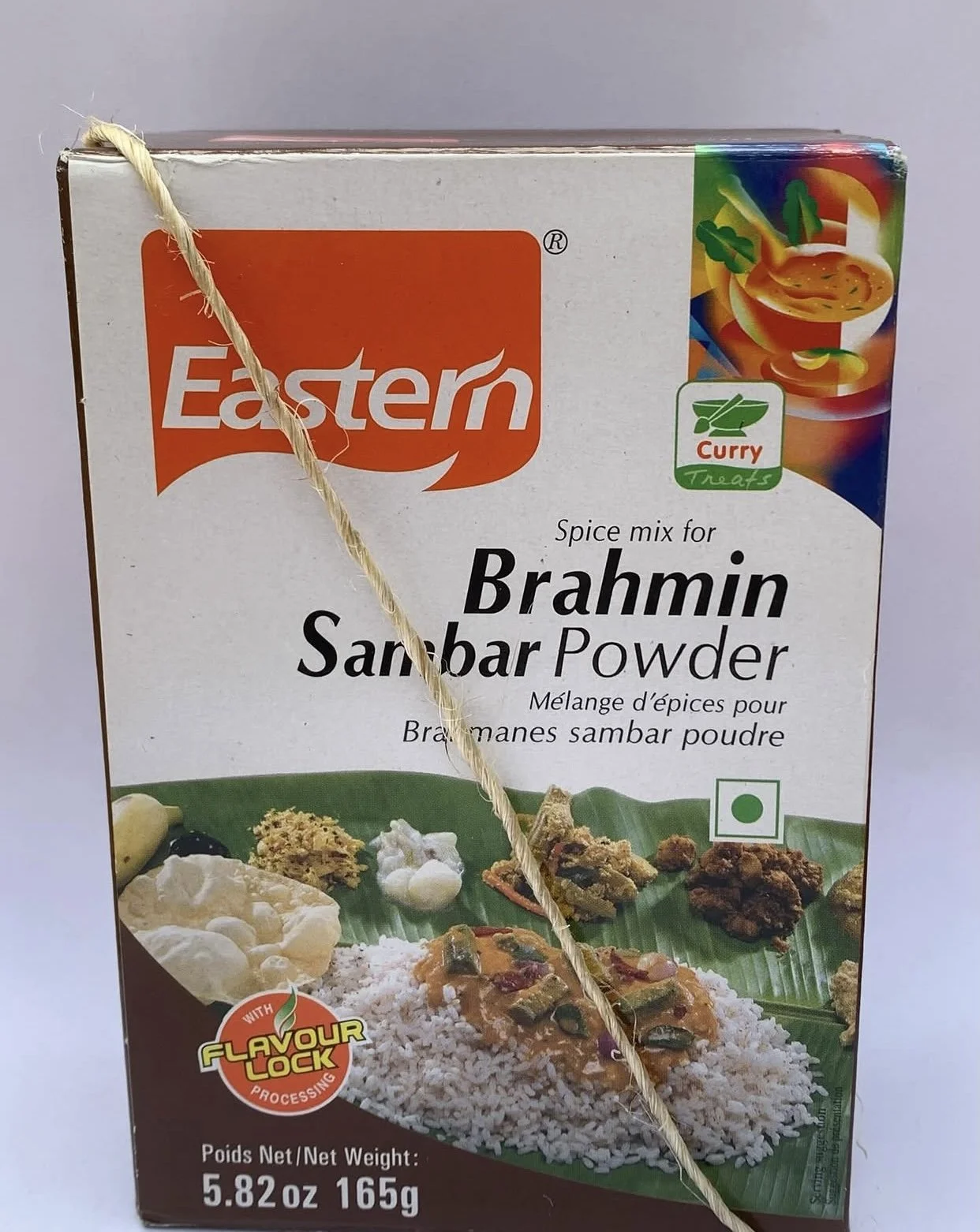 Box of Eastern Brahmin Sambar Powder bound with rope, referencing caste, ritual, purity, and diasporic food branding.