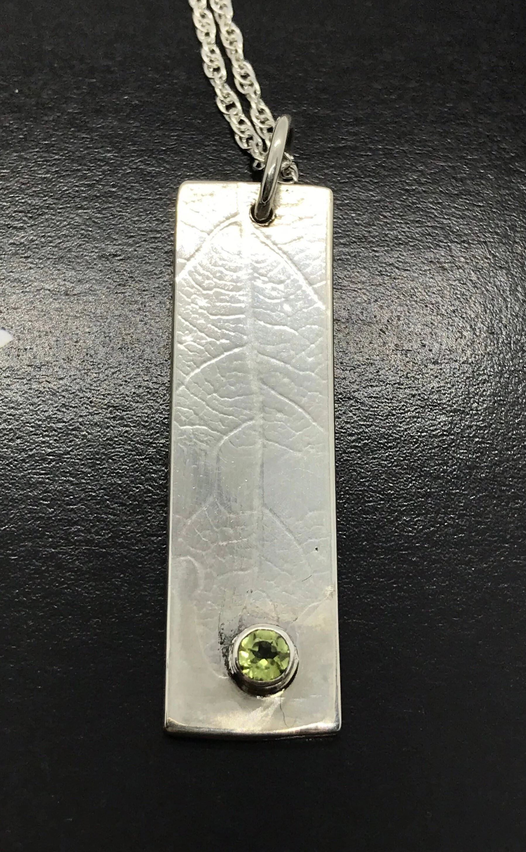 Contemporary Oak Leaf and peridot  pendant hand made with recycled silver