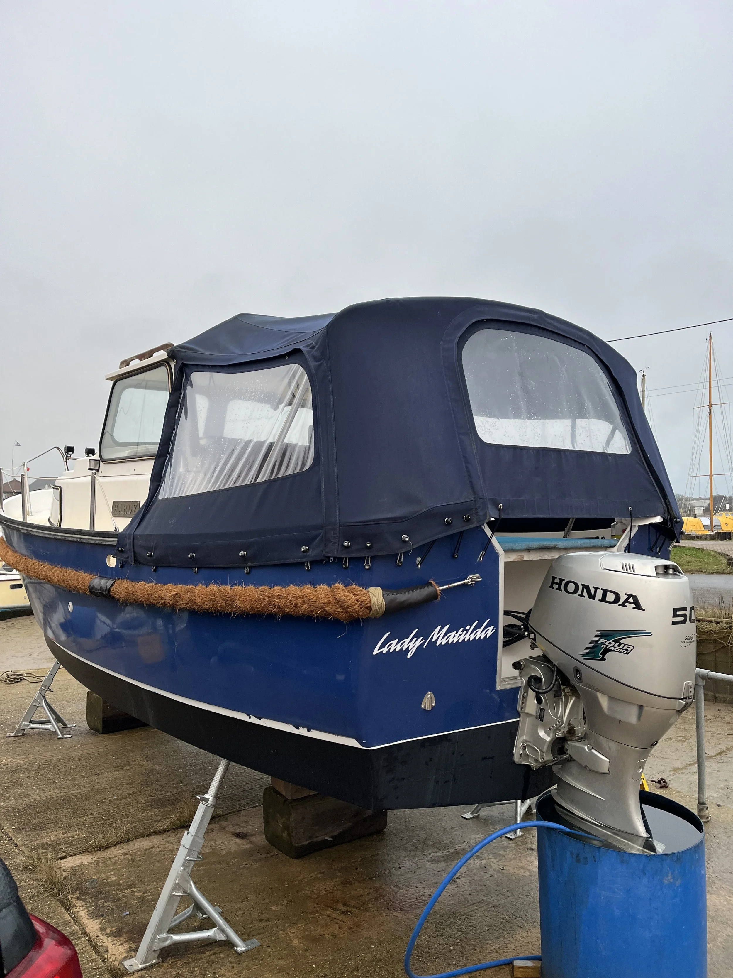 Boat from rear port side and Honda outboard