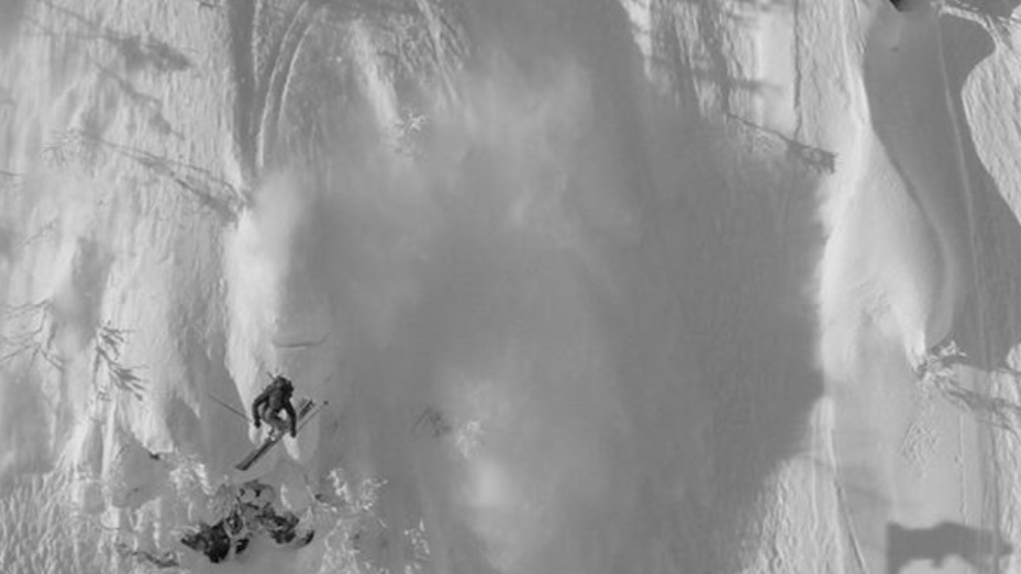 Skier descending deep powder in Japan