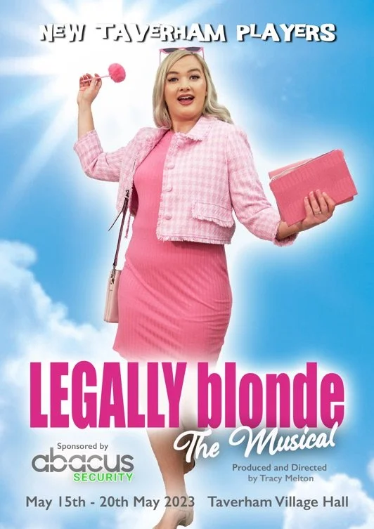 Promotional poster for the musical 'Legally Blonde,' featuring a blonde woman in pink outfit holding a pink purse and a pink fluffy pen, against a cloudy blue sky background. Text indicates a new Taverham players production running from May 15th to May 20th, 2023, at Taverham Village Hall, sponsored by Abacus Security.