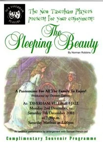 Poster advertising the play 'Sleeping Beauty' by Norman Robbins, presented by the New Taverham Players, featuring a fairy-tale theme with a princess in a gown and a prince in armor, showing performance dates and times.